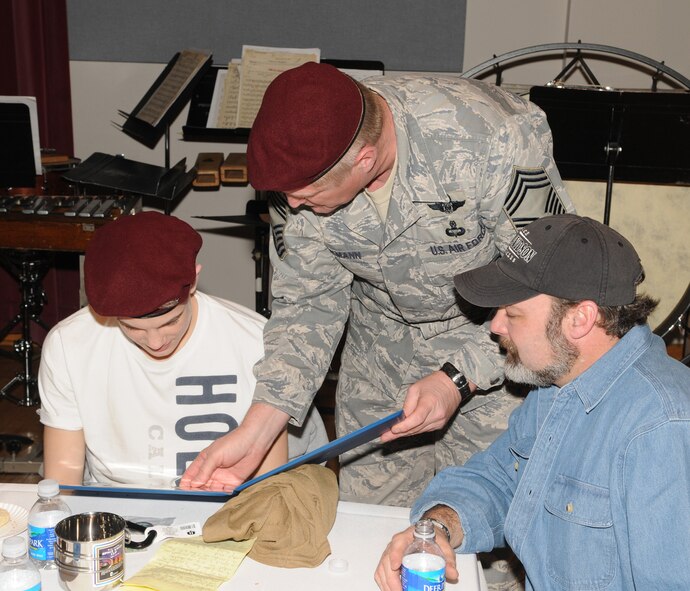 Chief Master Sgt. Ryan Beckmann makes a child from the Make-A-Wish Foundation an honorary Air Force Pararescueman March 20 on Bolling. The Make-A-Wish Foundation was invited to Bolling for the day to learn about the Air Force and the 11th Wing and has been granting wishes to children with progressive, degenerative or malignant conditions since 1980. The Make-A-Wish Foundation has reached more than 167,000 children around the world. (U.S. Air Force photo by Senior Airman Sean Adams)