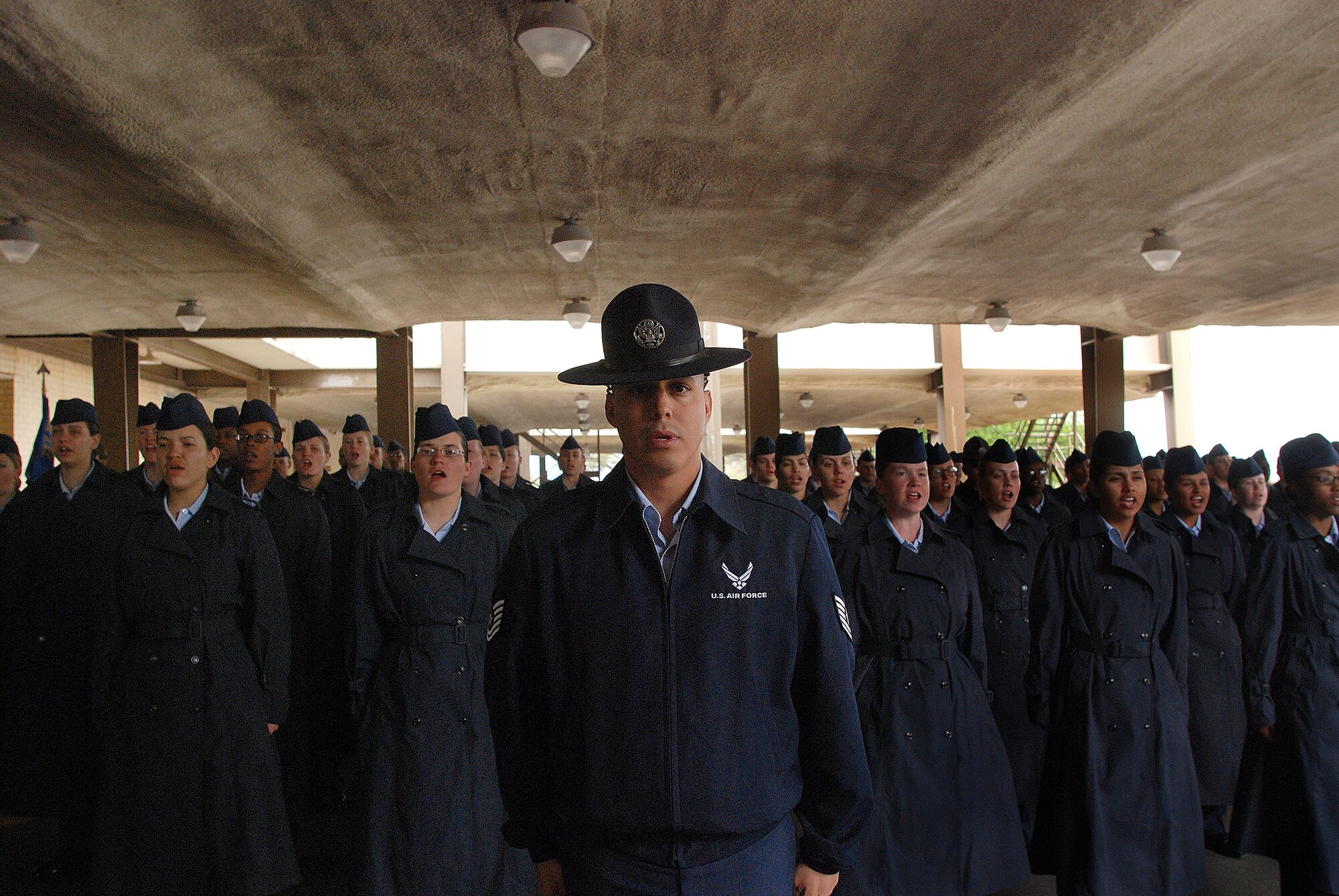Technical Sgt. Ricardo Chavez recites the Airman's Creed in formation with basic trainees from the 321st Training Squadron in preparation for graduation March 11 at Lackland Air Force Base, Texas. Sergeant Chavez is a 433rd Airlift Wing Reserve military training instructor. (U.S. Air Force photo/Airman Brian McGloin) 
