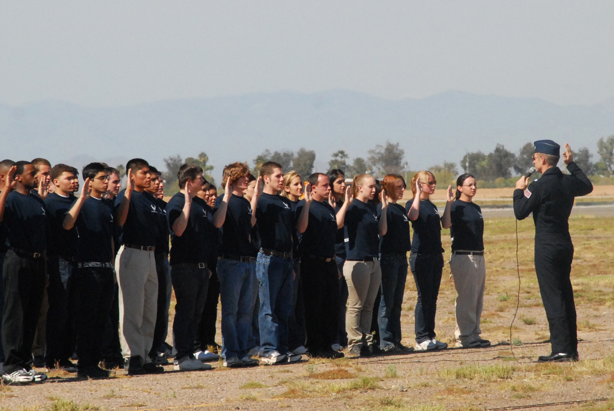 Members of the Delayed Entry Program from the Phoenix area state their Oath of Enlistment with the U.S. Air Force Thunderbird Aerial Demonstration Team during the 2009 Thunder in the Desert Air Show, March 21. (U.S. Air Force photo/Airman 1st Class Tracie Forte)