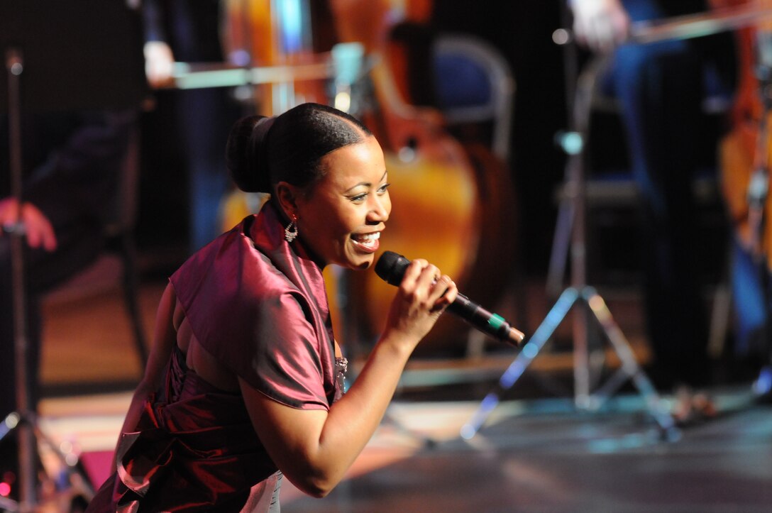 Master Sgt. Coonrod engages the audience with her winning smile and musical flair.