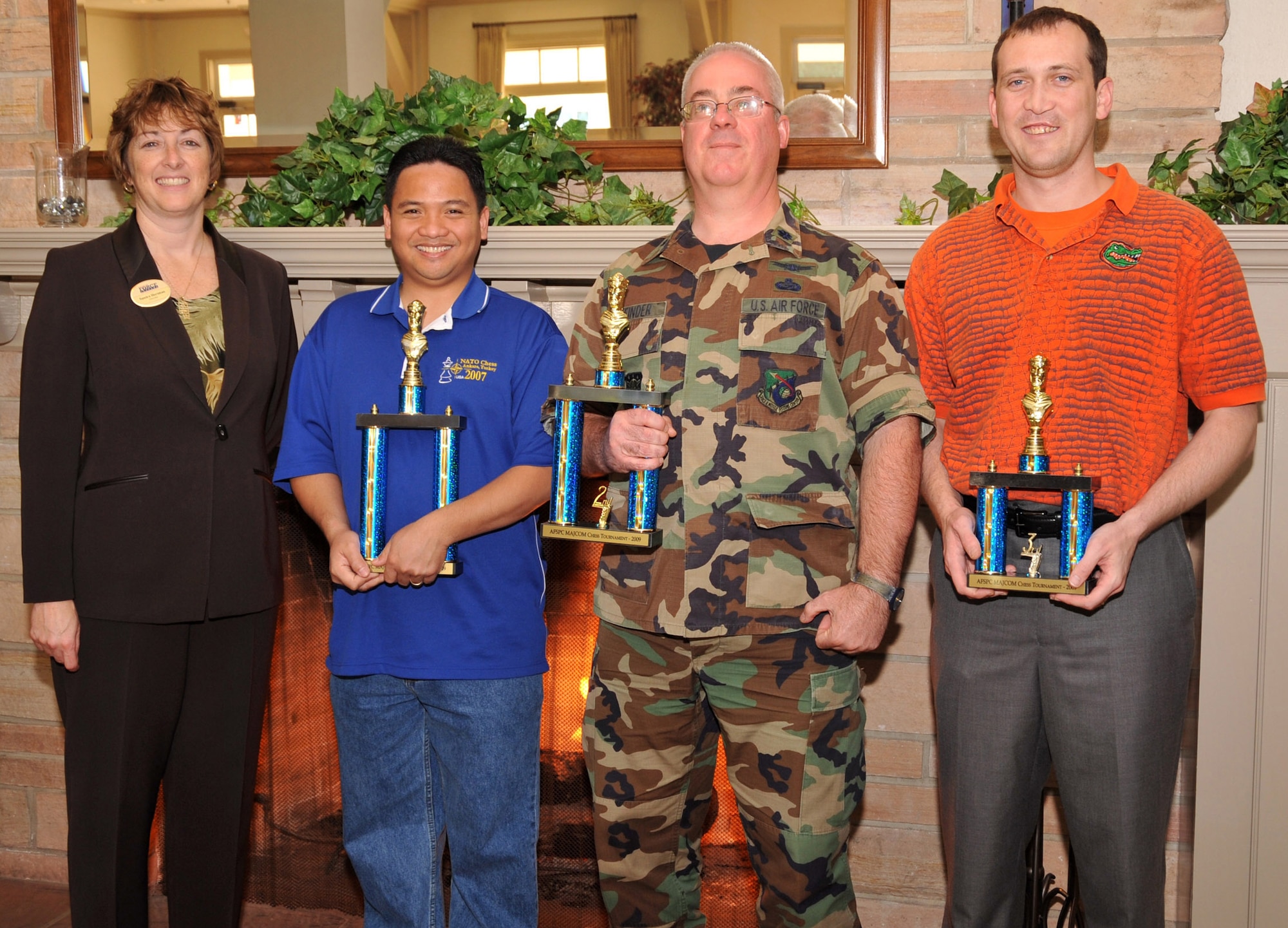 SMC’s Lt. Col. Douglas Taffinder placed second at the Air Force Space Command’s MAJCOM-Level chess tournament held here, March 13.  Tech. Sgt. Nathaniel Ola from Vandenberg AFB took the top prize and Maj. Robert Jertberg also from Vandenberg placed third.  Sandra Horsman, chief of LAAFB Services, awarded the trophies to the top finishers. (Photo by Lou Hernandez)