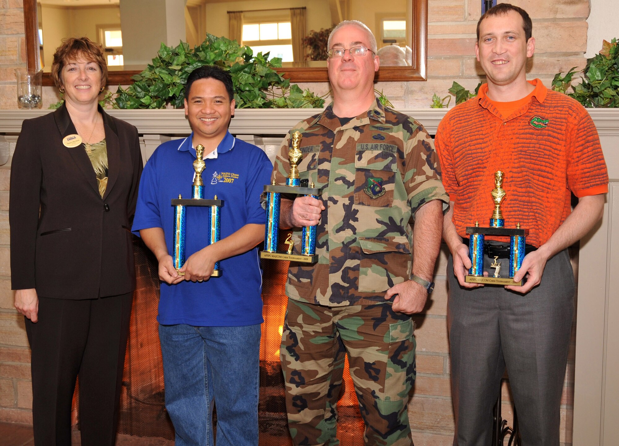 SMC’s Lt. Col. Douglas Taffinder placed second at the Air Force Space Command’s MAJCOM-Level chess tournament held here, March 13.  Tech. Sgt. Nathaniel Ola from Vandenberg AFB took the top prize and Maj. Robert Jertberg also from Vandenberg placed third.  Sandra Horsman, chief of LAAFB Services, awarded the trophies to the top finishers. (Photo by Lou Hernandez)