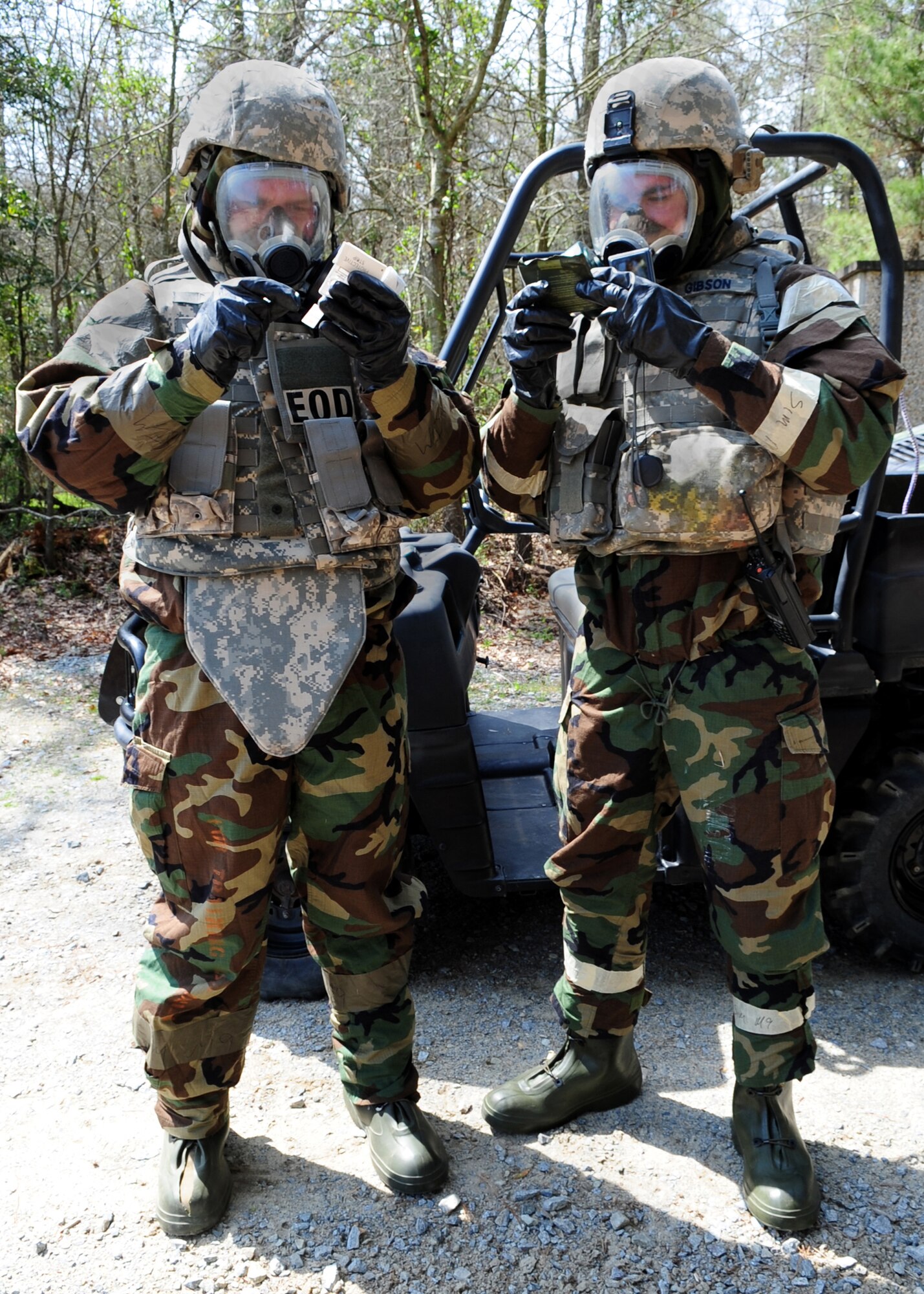 Airman 1st Class Brandon Martin and Senior Airman Cooper Gibson, 4th Civil Engineer Squadron explosive ordnance disposal specialists, test themselves for the presence of chemical agents during a training exercise at Seymour Johnson Air Force Base, N.C., March 19, 2009. The Airmen conduct exercises to stay sharp for deployments. Chemical agents can cause a variety of symptoms including: sever skin irritation, itching, blindness, flu-like symptoms, coughing and choking. (U.S. Air Force Photo by Airman 1st Class Rae Perry)