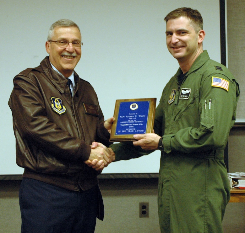 NIAGARA FALLS AIR RESERVE STATION, N.Y. - Maj. Gen. Martin Mazick, commander of 22nd Air Force (left), presents Capt. Anthony Wilmot of the 914th Airlift Wing with the 22 AF Outstanding Aircrew Flight Equipment Officer award for 2008.  (U.S. Air Force photo by Tech. Sgt. Kevin Nichols)