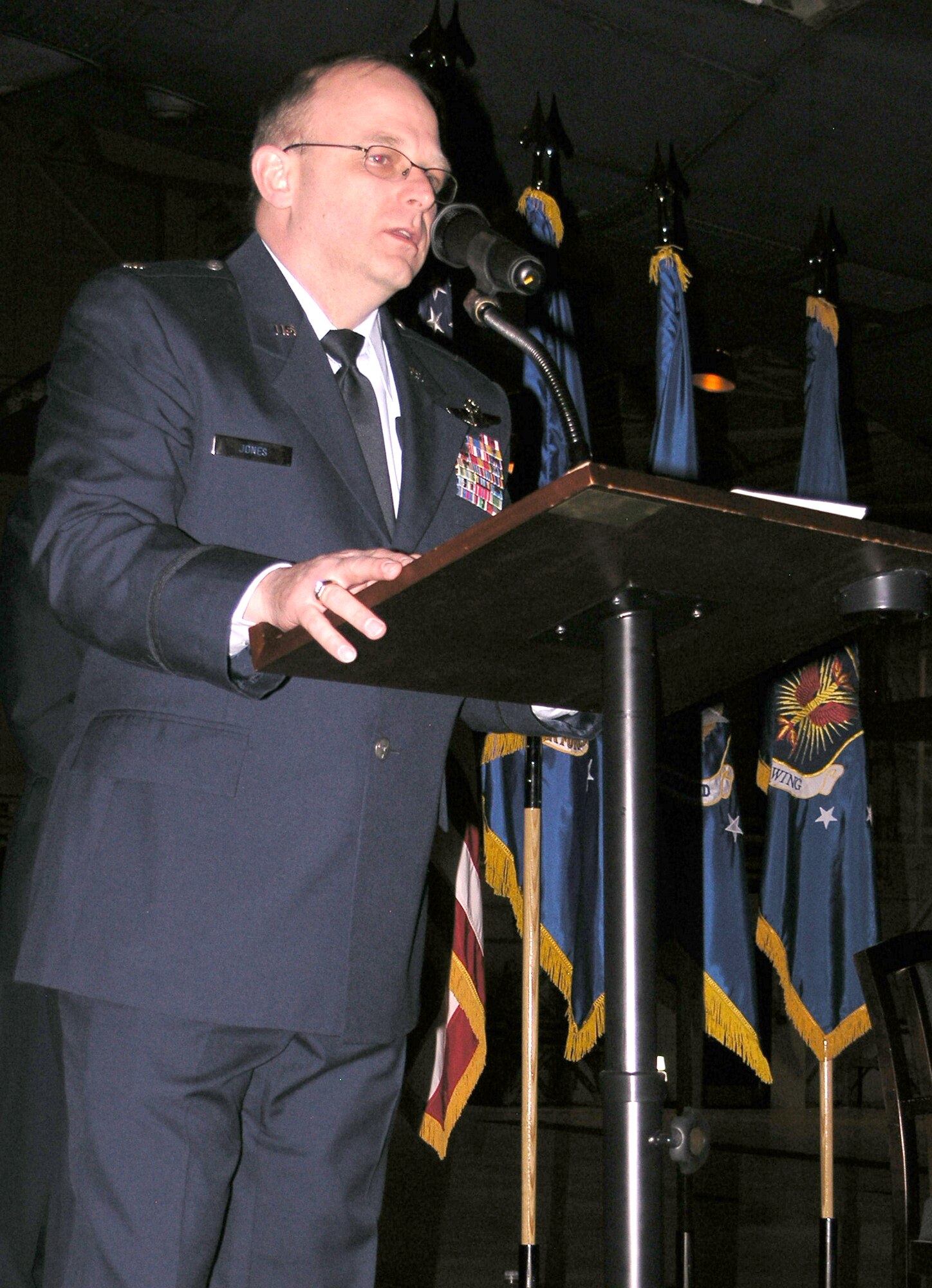 Col. Kurt. T Jones addresses members of the 302nd Operations Group after a change of command ceremony Feb. 8 at Peterson Air Force Base, Colo. Colonel Jones replaced Col. Karl Schmitkons as the new commander of 302nd OG. Colonel Jones takes over the command after serving as deputy commander of Dover AFB's 512th OG in Delaware. (U.S. Air Force photo/Tech. Sgt. David. D. Morton) 