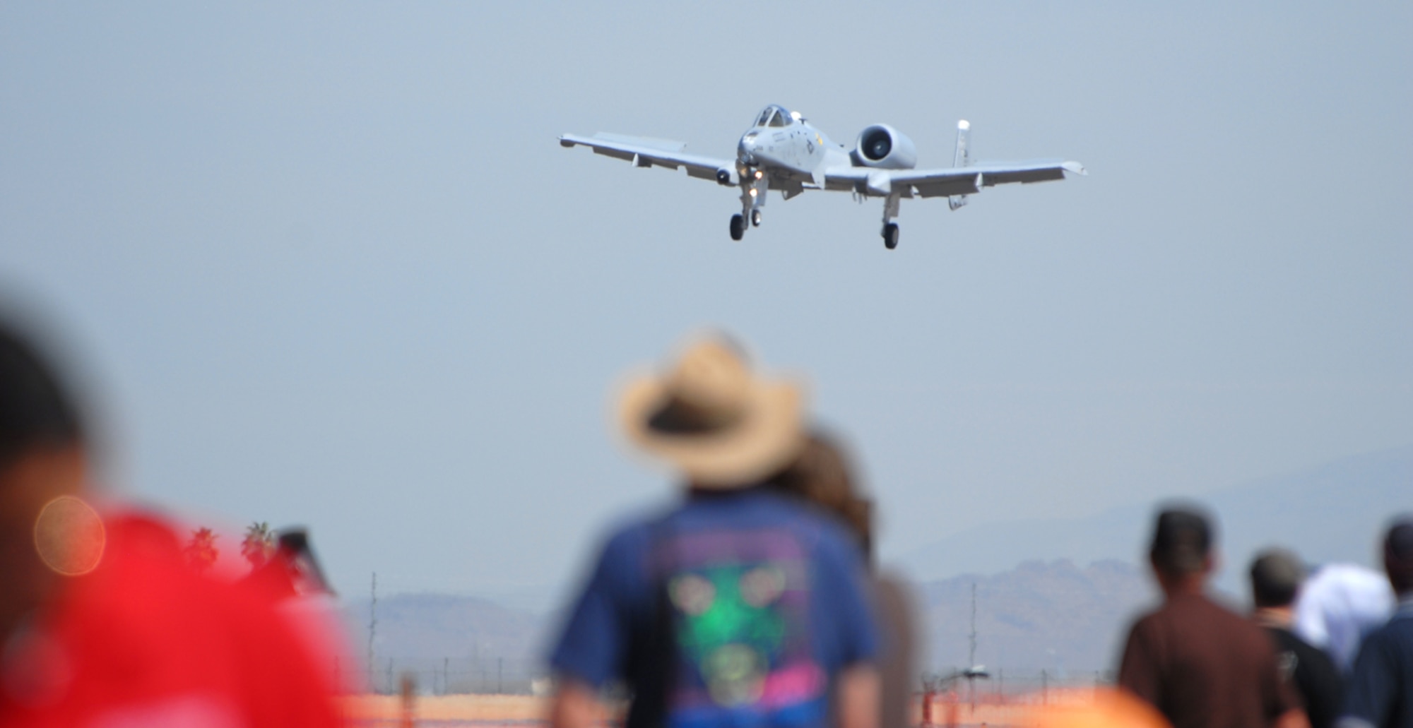 The A-10 Thunderbolt II flys over a crowd of people during the 2009  Thunder in the Desert Air Show March 21.  (U.S. Air Force photo/Airman 1st Class Ronifel Yasay)