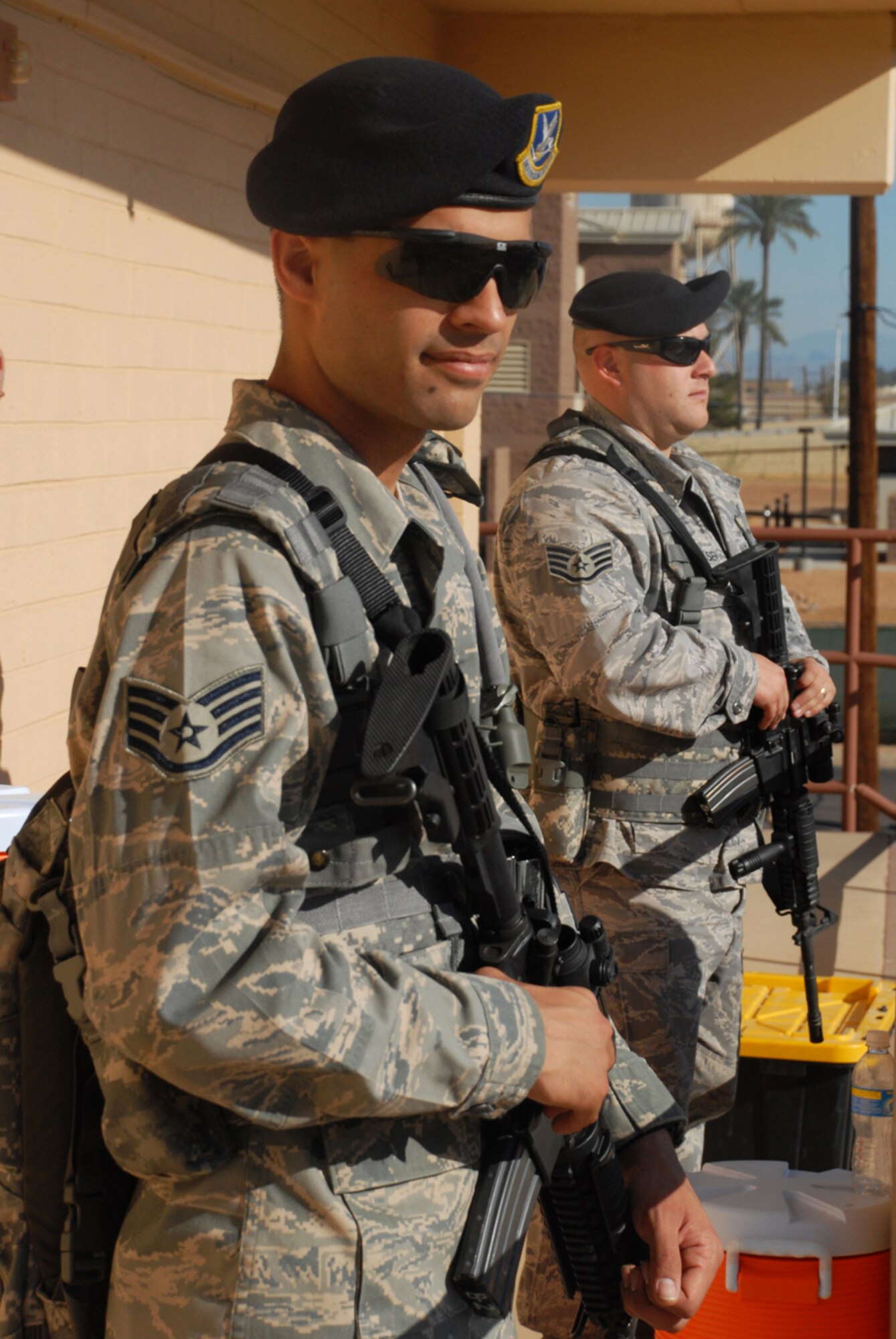 Staff Sgt. Matthew Buchan and Staff Sgt. Aric Jacobson, both from the 56th Security Forces Squadron, provide security at the pedestrian entrance during the 2009 Thunder in the Desert Air Show, March 21. (U.S. Air Force photo/Airman 1st Class Tracie Forte)