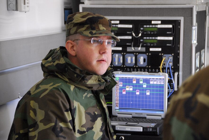 U.S. Air Force Senior Airman Jeremiah Santmyer, 148th Fighter Wing Communications Squadron, operates a communication network in the Joint Communications Platform (JCP) Aug 23, 2008 in Duluth, Minn. The JCP is one of two mobile communications platforms in Minnesota.  It provides satellite uplink and downlink, telephone, radio, data, and wireless capabilities to provide command and control functions.