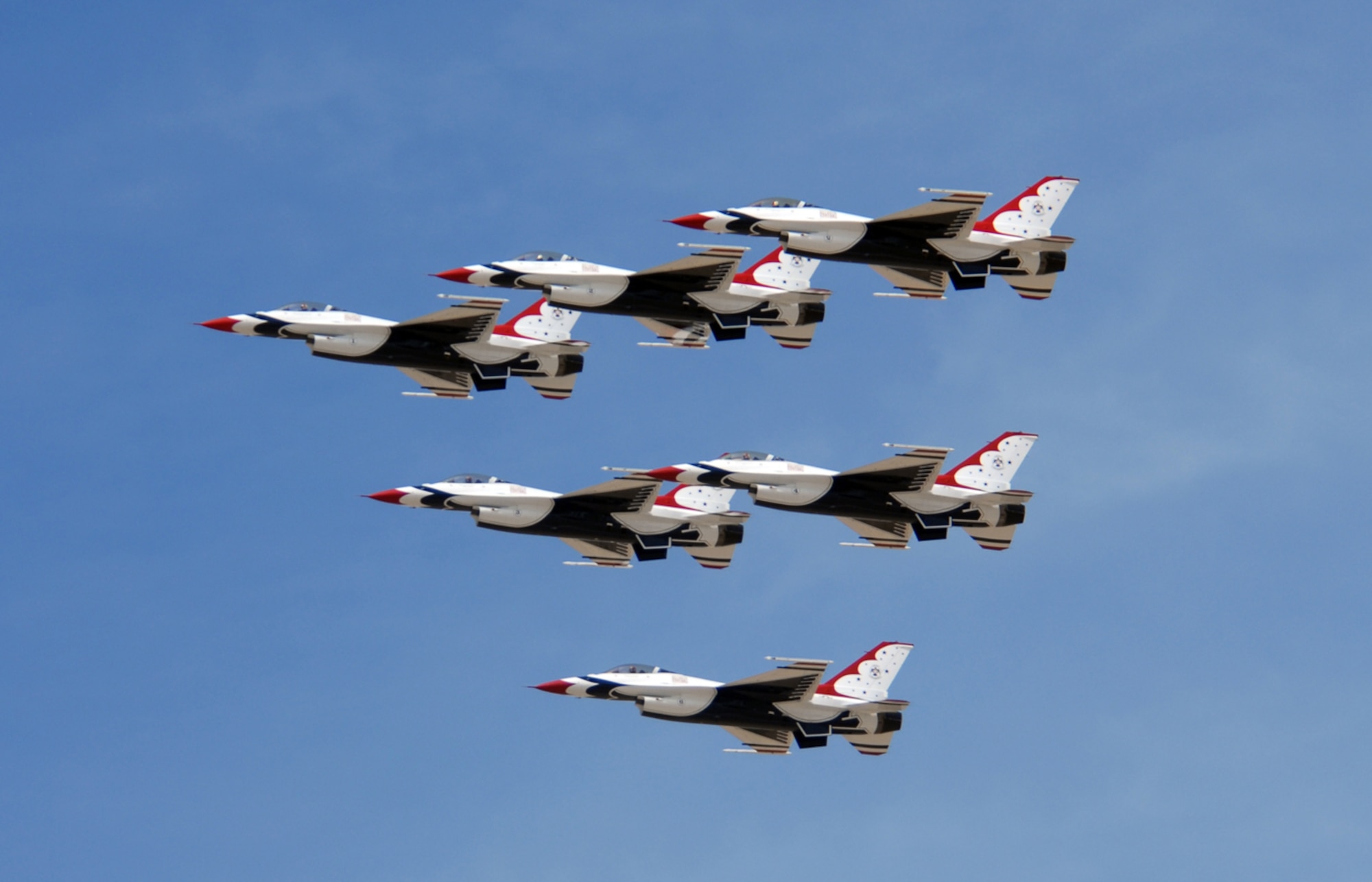 The U.S. Air Force Thunderbird Aerial Demonstration Team soar through the sky overlooking Luke Air Force Base during a practice show prior to the 2009  Thunder in the Desert Air Show March 19. (U.S. Air Force photo/Airman 1st Class Ronifel Yasay)