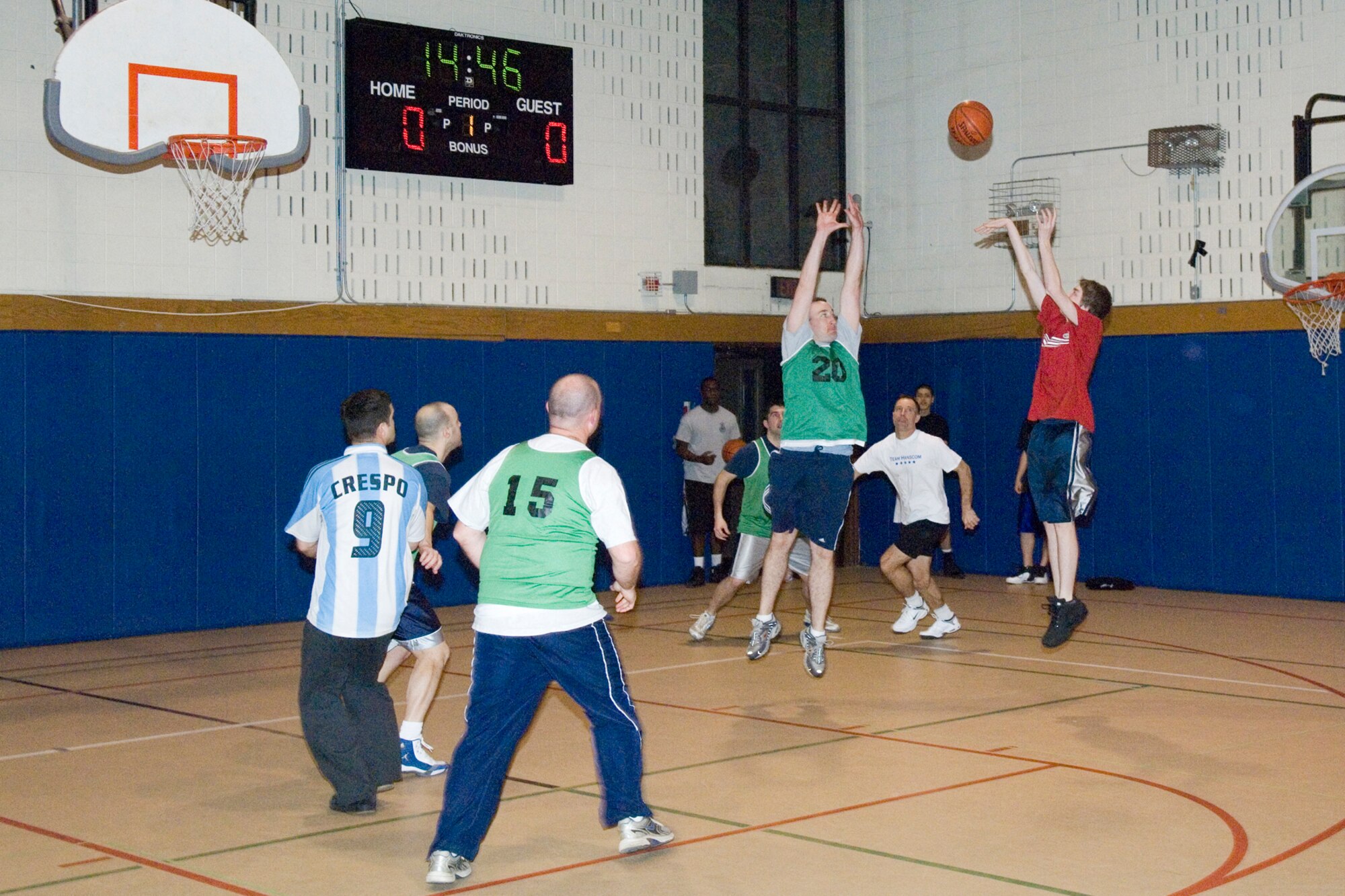 HANSCOM AIR FORCE BASE, Mass. – Hanscom teenagers play basketball with members of the 66th Security Forces Squadron and 66th Air Base Wing leadership on March 20, during Operation Night Hoops. In its sixth year, Operation Night Hoops provides a positive forum for community agencies to stress the importance of enjoying a drug, alcohol and tobacco free life and to offer positive alternatives. The program is sponsored by the Youth Center and 66 SFS volunteers. (U.S. Air Force photo by Rick Berry)