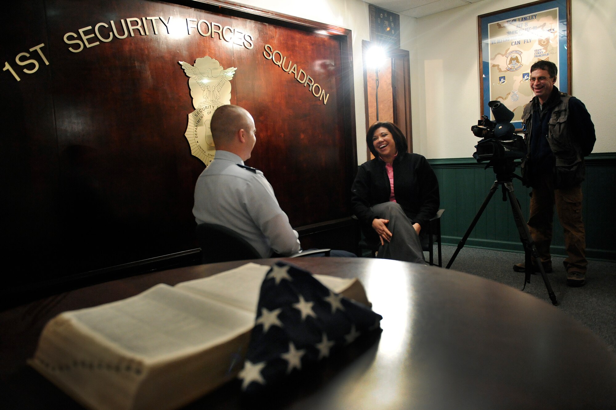 LANGLEY AIR FORCE BASE, Va. -- Mrs. Bianca Martinez, WTKR Channel 3 broadcaster, interviews Capt. Brett Healey, 1st Security Forces Squadron operations flight chief, about the day-to-day mission of military policemen, here March 23.  Mrs. Martinez started a series entitled "Do My Military Job," which allows her to learn about various jobs within each branch of the military.  (U.S. Air Force photo/Senior Airman Vernon Young)