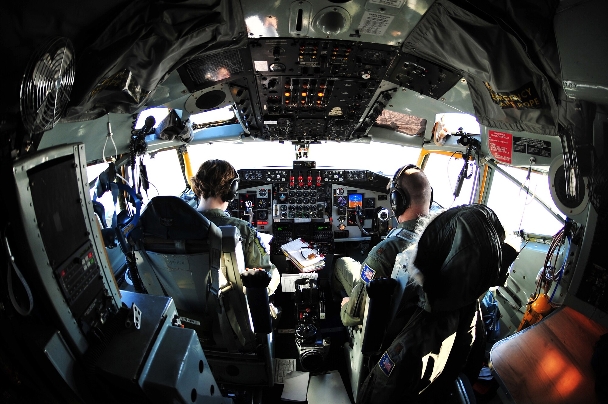 Two crewmembers from the 168th Air Refueling Wing conduct a preflight check of their aircraft March 22, 2008, Eielson Air Force Base, Alaska. The mission of the 168th Air Refueling Wing is to train Alaska's Guardsmen who provide a constant Air Force capability of global reach and vigilance, by means of the KC-135 aircraft and early warning space system, and stand ready to protect American resources and Alaskan communities. (U.S. Air Force photo/Airman 1st Class Willard E. Grande II)