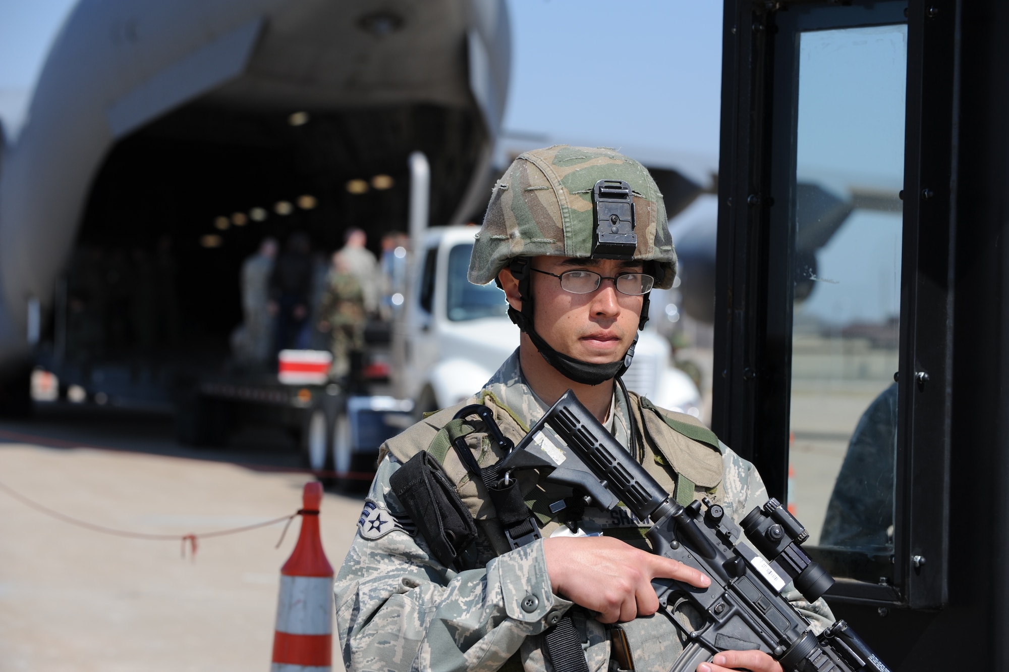 WHITEMAN AIR FORCE BASE, Mo. – Senior Airman Brian Shaw, 509th Security Forces Squadron, checks personnel in at the designated entry control point for a simulated logistics movement at the munitions storage area during a Nuclear Surety Inspection March 16.  (US Air Force Photo/Staff Sgt. Charles Larkin)