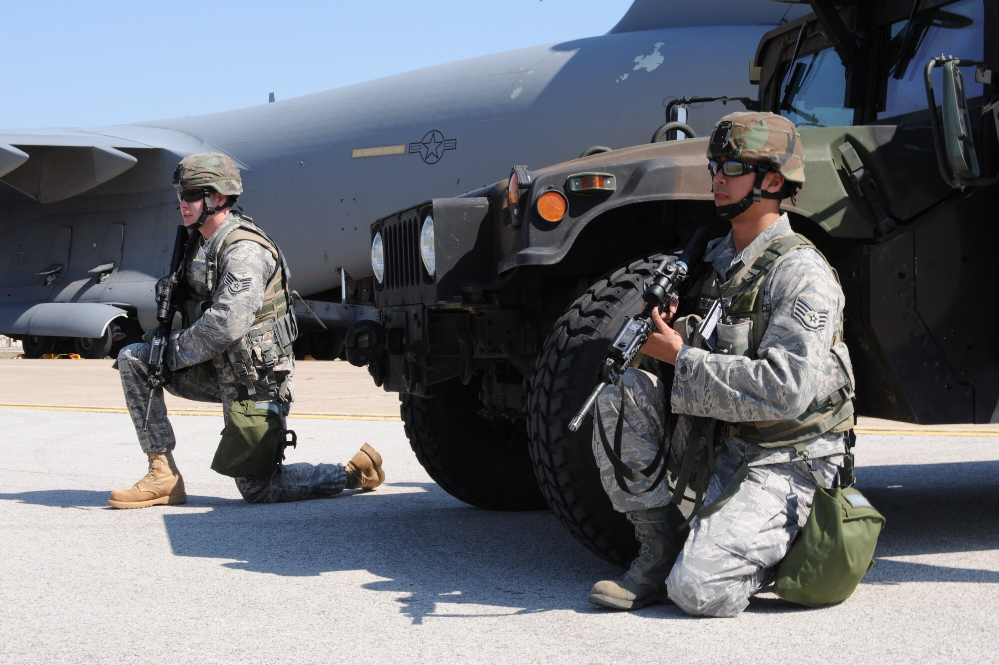 WHITEMAN AIR FORCE BASE, Mo. – Staff Sgt. Robert Dotson (left) and Staff Sgt. Michael Bermudez, 509th Security Forces Squadron, provide perimeter security for a simulated logistics movement at the munitions storage area during a Nuclear Surety Inspection March 16.