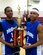 Marcell and Marcus E. Hughes, sons of Master Sgt. Marcus G. Hughes III, stand with the 2009 New Jersey Catholic Youth Organization State High School Basketball Championship trophy on March 7, 2009, at St. Leo the Great High School in Lincroft, N.J.  Both Marcell and Marcus were starters for the McGuire Air Force Base (N.J.) Falcons as they beat St. Mary's of the Lakes of Medford, N.J., 54-52 for the championship.  In the game, Marcell had 10 assists, two points, and two steals.  Marcus added 15 rebounds, five points and two steals.  Neither earned most valuable player -- that honor went to senior guard Donnie Redding who scored 24 points. (U.S. Air Force Photo/Master Sgt. Marcus G. Hughes III)