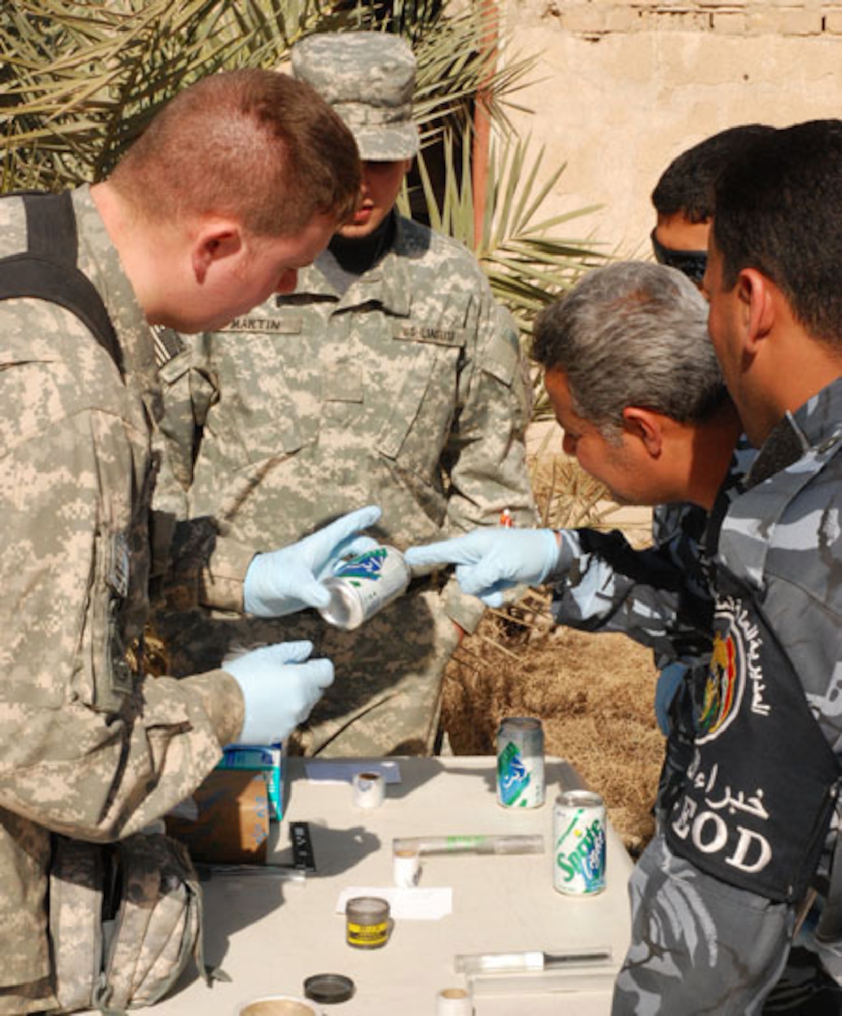 Members of the weapons intelligence team provide counter improvised explosive device intelligence through collection, analysis and tactical exploitation in support of Multinational Corps-Iraq in February in Iraq. By collecting evidence and staying ahead of the enemy, the WIT helps prepare U.S. and coalition forces prepare for future attacks. (Courtesy photo) 
