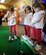 LANGLEY AIR FORCE BASE, Va.-- Identical triplets, daughters of Lt. Col. Richard Basak, Air Combat Command Operations Directorate, play a game of putt-putt during Spring Fling events at the Shellbank Youth Center March 23. The Spring Fling was a day of fun and games for the families of deployed Airmen. (U.S. Air Force photo/Airman Rebecca Montez)
