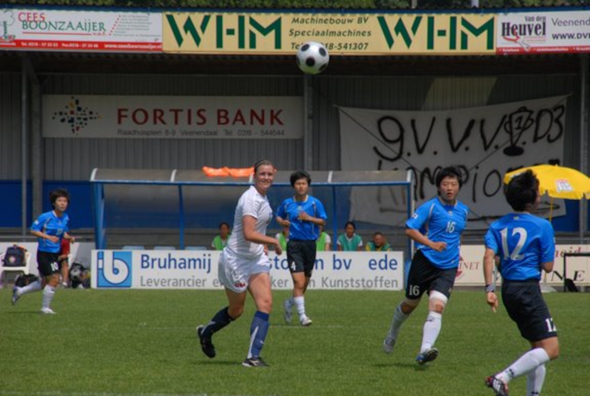 HANSCOM AIR FORCE BASE, Mass. – First Lieutenant Jamie Andrews (white uniform) keeps an eye on the ball after clearing it from her defensive zone in a game against South Korea in the 2008 Conseil International Du Sport Militaire, an international tournament in which military teams from around the world compete in various sporting events. The U.S. tied the game with South Korea with a score of 2-2. Lieutenant Andrews has played on the Women’s Armed Forces soccer team for the past three years and is setting her sites on once again representing her country at this year’s competition which will take place at Keesler Air Force Base June 4 to 14. (Courtesy photo)