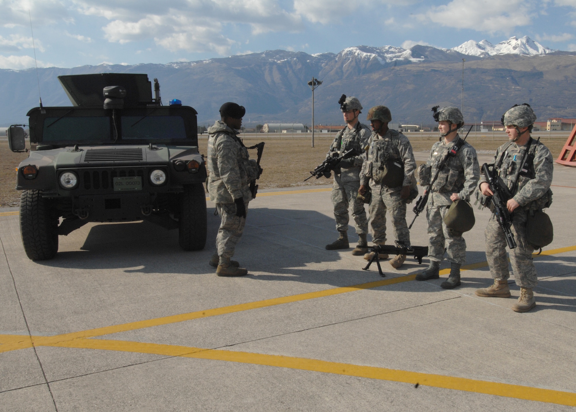 Staff Sgt. Xavier Daniel, 31st Security Forces Squadron, briefs Airmen after a base exercise March 20 on the flightline. The 31st SFS maintains installation force protection during peacetime and wartime operations at eight base areas throughout the Aviano community.  (U.S. Air Force photo/Airman 1st Class Tabitha M. Mans)