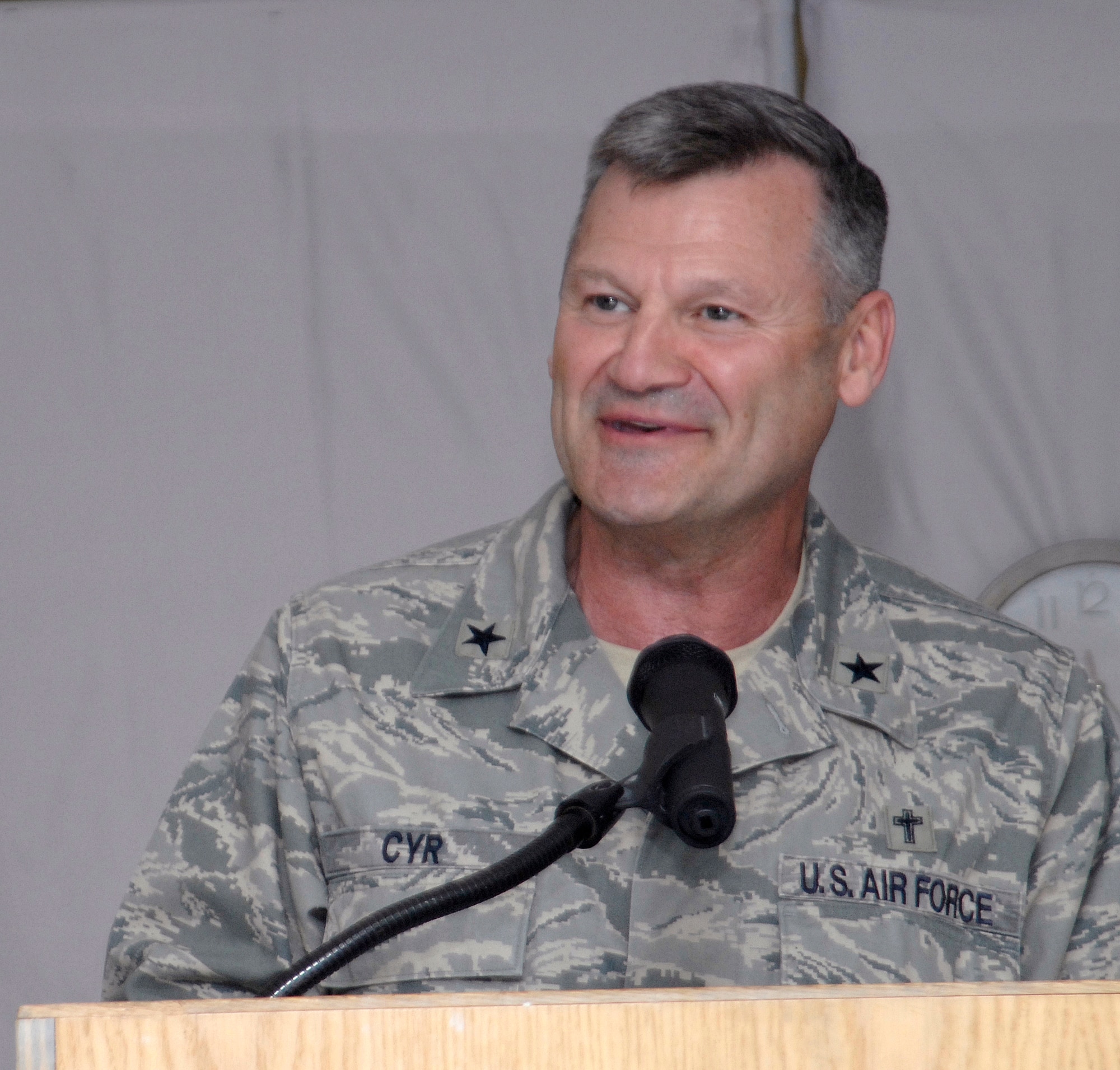 Brigadier General David H. Cyr, Air Force Deputy Chief of Chaplains, speaks during the National Prayer Dinner giving praise to servicemembers for their spiritual strength and ability to do their mission in the U.S. Central Command's area of responsibility, Mar. 20, 2009, at an undisclosed location in Southwest Asia.  Airmen, Soldiers, Sailors, and Marines all shared dinner together in honor of their faith and for their spiritual needs.  The service members are deployed in support of Operations Iraqi and Enduring Freedom and Combined Joint Task Force - Horn of Africa.  (U.S. Air Force photo/Senior Airman Andrew Satran/released)