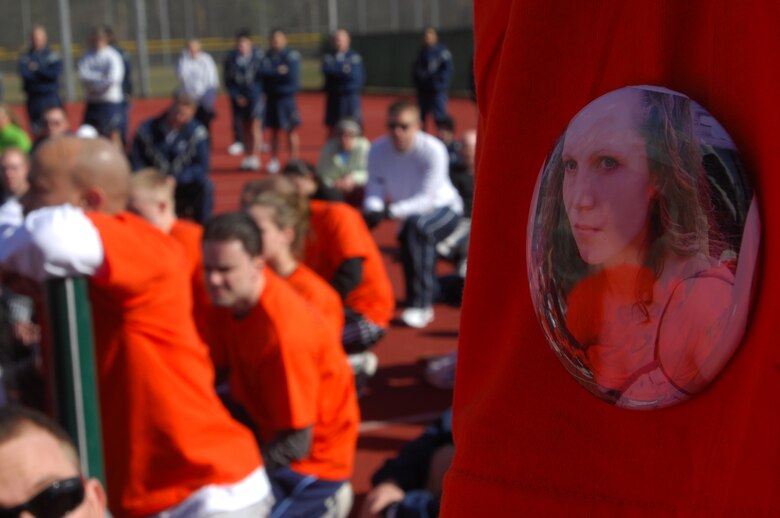 Over 300 U.S. Air Force Airmen and dependents wear buttons in honor of Tech. Sgt. Jessica Sweet during a 5K LOVESWEET memorial run, March 18, 2009, Ramstein Air Base, Germany. Sergeant Jessica Sweet, 435th Communication Squadron supply, lost a hard fought battle to acute myelogeneous leukemia Feb. 12. (U.S. Air Force photo by Airman 1st Class Kenny Holston)