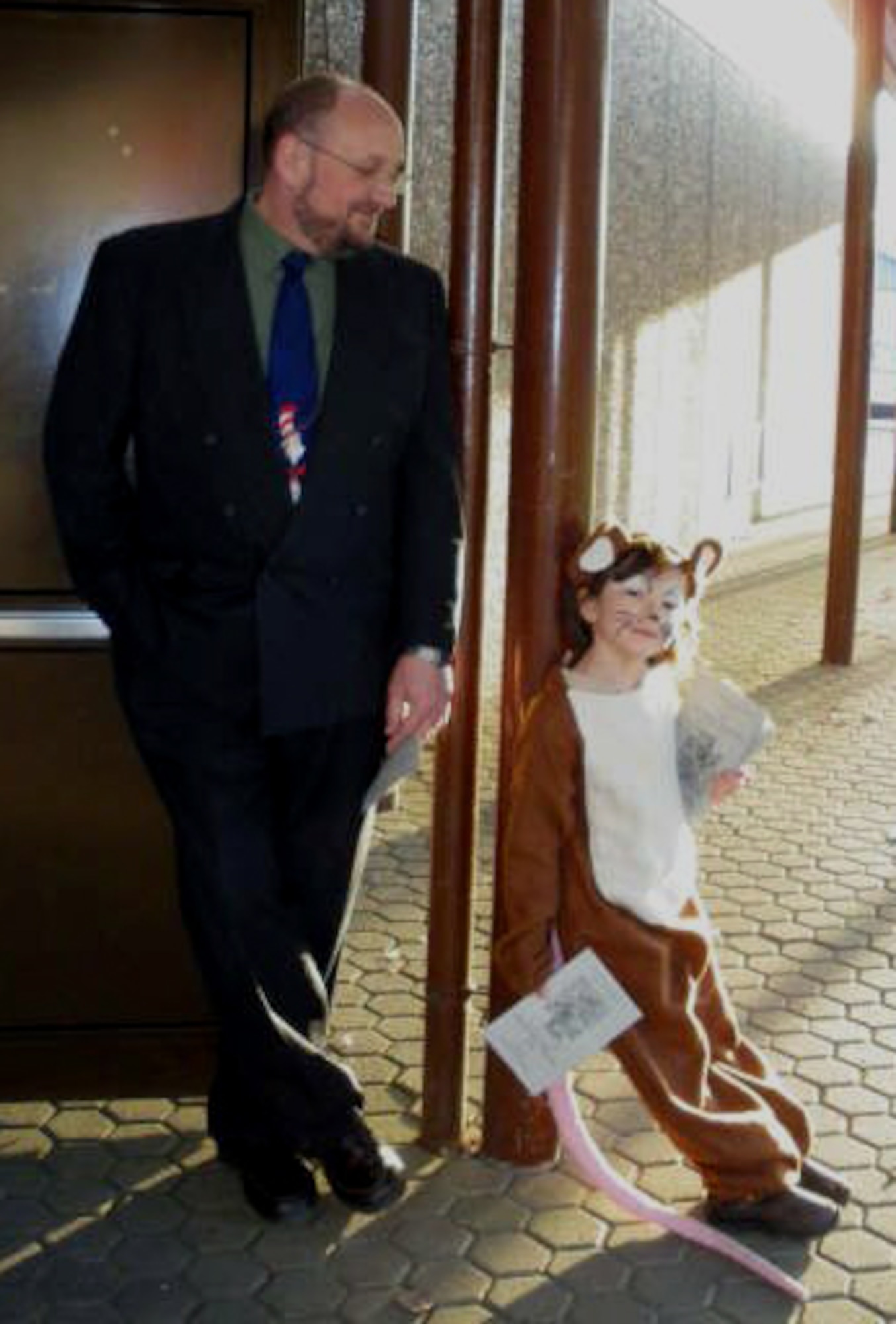 SPANGDAHLEM AIR BASE, Germany – Richard Alix, Spangdahlem Elementary School principal, keeps an eye on Emiko Groder, SPES student, before members of Mrs. Harvin's Drama Club preformed "Rats! The Tale of the Pied Piper" March 18-19, 2009. Emiko is the daughter of Master Sgt. Michael Groder, 52nd Security Forces Squadron. (Photo by Kristin Bleha) 