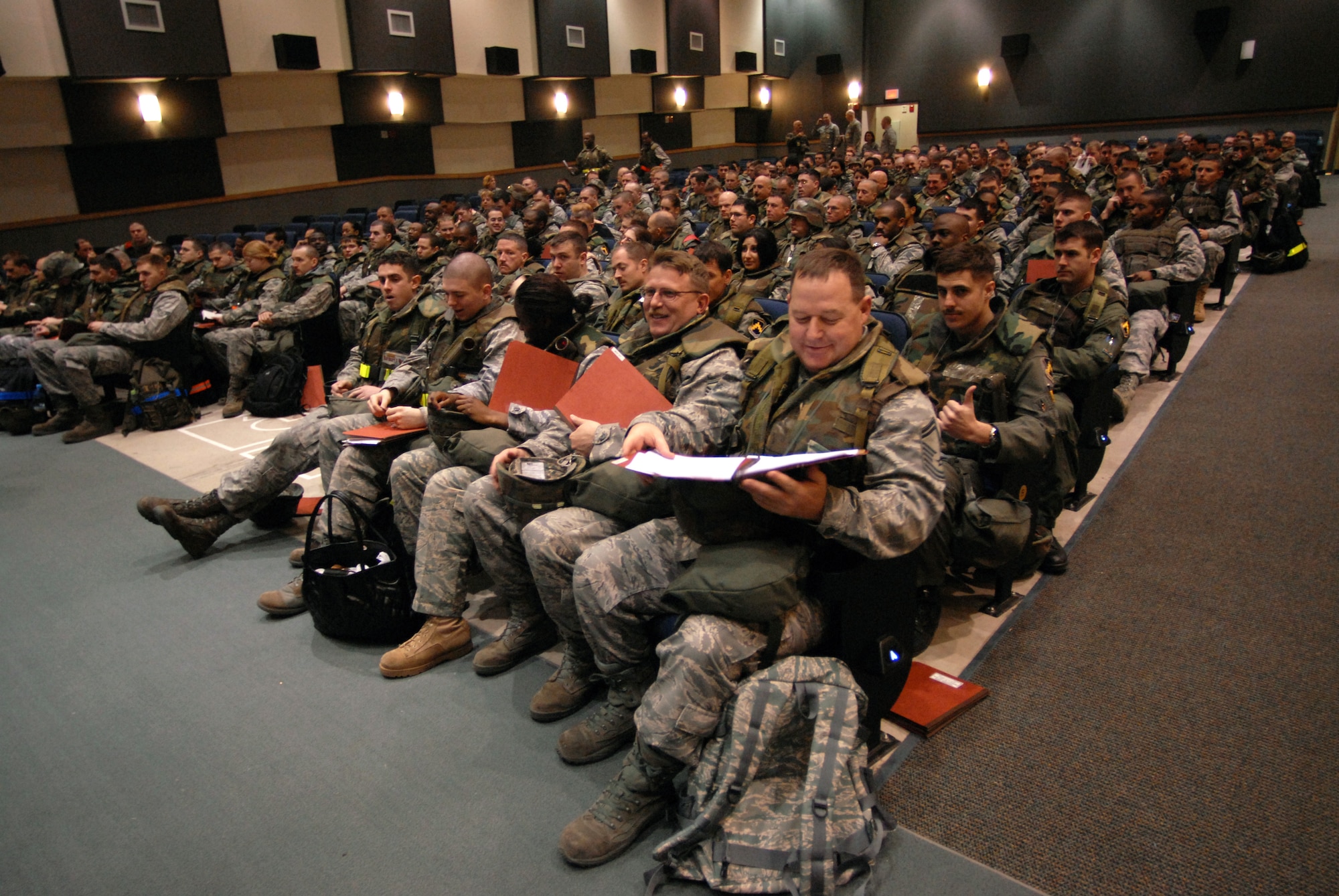 More than 200 Airmen wait to process through the Personnel Deployment Reception Function during Wolf War day at Kunsan Air Base, Republic of Korea, March 23, 2009. The 8th Fighter Wing Airmen participate in Wolf War day practicing their war time capabilities in preparation for the Peninsula Wide Operational Readiness Exercise and Inspection. (US Air Force photo By: Senior Airman Angela Ruiz) 
