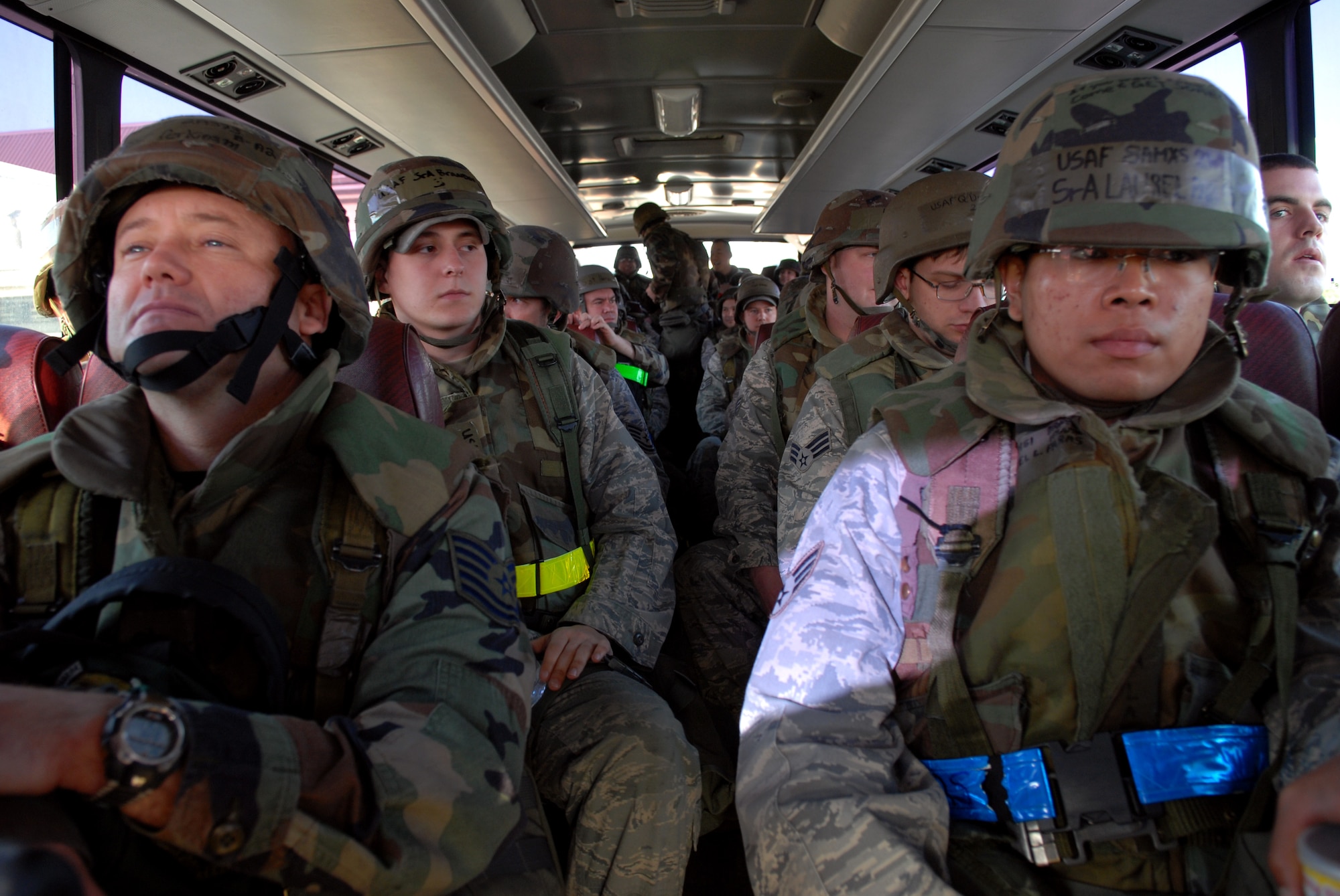 More than 200 Airman from the 8th Fighter Wing are transported to the cargo handling area during Wolf War day at Kunsan Air Base, Republic of Korea, Mar. 23, 2009. The 8th Fighter Wing Airmen participate in Wolf War day practicing their war time capabilities in preparation for the Peninsula Wide Operational Readiness Exercise and Inspection. (US Air Force photo By: Senior Airman Angela Ruiz) 