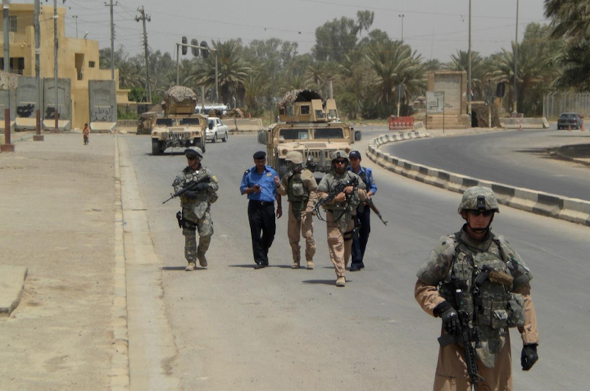 BAGHDAD, Iraq – Members of the 732nd Expeditionary Security Forces Detachment 3 and the Iraqi Police patrol the streets in Baghdad. Airmen and Soldiers with the 732nd ESFS train and mentor the Iraqi Police, helping them become a more stable and self-reliant police force. (Courtesy photo)