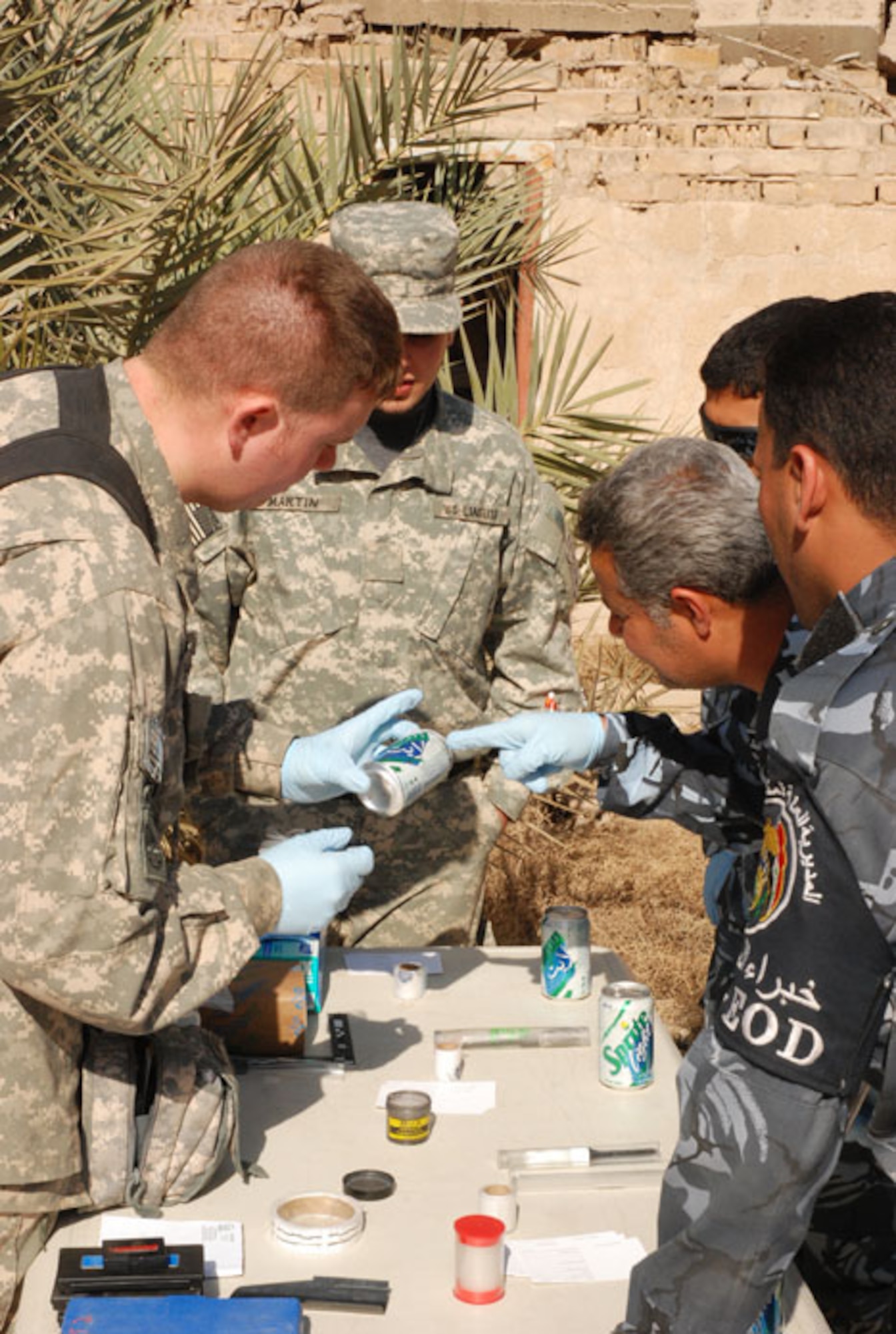 Members of the Weapons Intelligence Team provide counter improvised explosive device intelligence through collection, analysis and tactical exploitation in support of Multi-National Corps Iraq.  As part of the Combined Joint Task Force Troy, the WIT is made up of personnel from the Air Force, Army, and Navy in a gamut of career fields. By collecting evidence and staying ahead of the enemy the WIT [helps prepare U.S. and coalition forces] prepare for future attacks.  (Courtesy photo)
