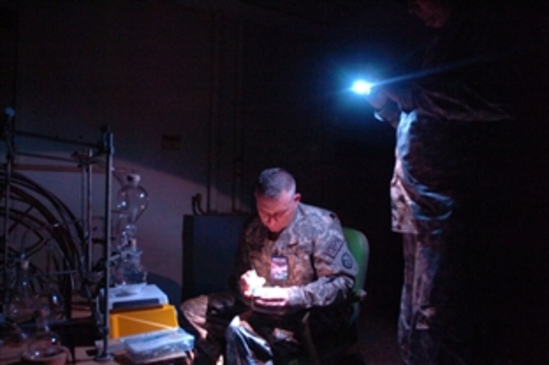 U.S. Army Sgt. David Reeves sets up a chemical lab as part of Operation Vigilant Guard near Ponce, Puerto Rico, March 24, 2009. Reeves and other members of the West Virginia National Guard's 35th Civil Support Team set up the lab as part of a scenario in which terrorists have acquired weapons of mass destruction, and teams from Puerto Rico and the Virgin Islands help civil authorities negate the threat.