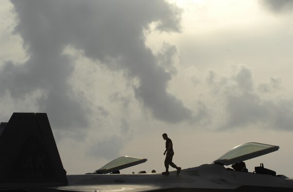 An F-22 Raptor maintainer performs a post flight visual inspection March 19 at Andersen Air Force Base, Guam during exercise Jungle Shield. The exercise will help ensure our forces are well prepared to conduct important homeland defense missions The Raptors are deployed from Elmendorf Air Force Base, Alaska, to Guam for three months as the Pacific's Theater Security Package. The stealth-fighters, along with associated maintenance and support personnel, comprise the 90th Fighter Squadron.

(U.S. Air Force photo/ Master Sgt. Kevin J. Gruenwald) released
























  












 











































  












 

























