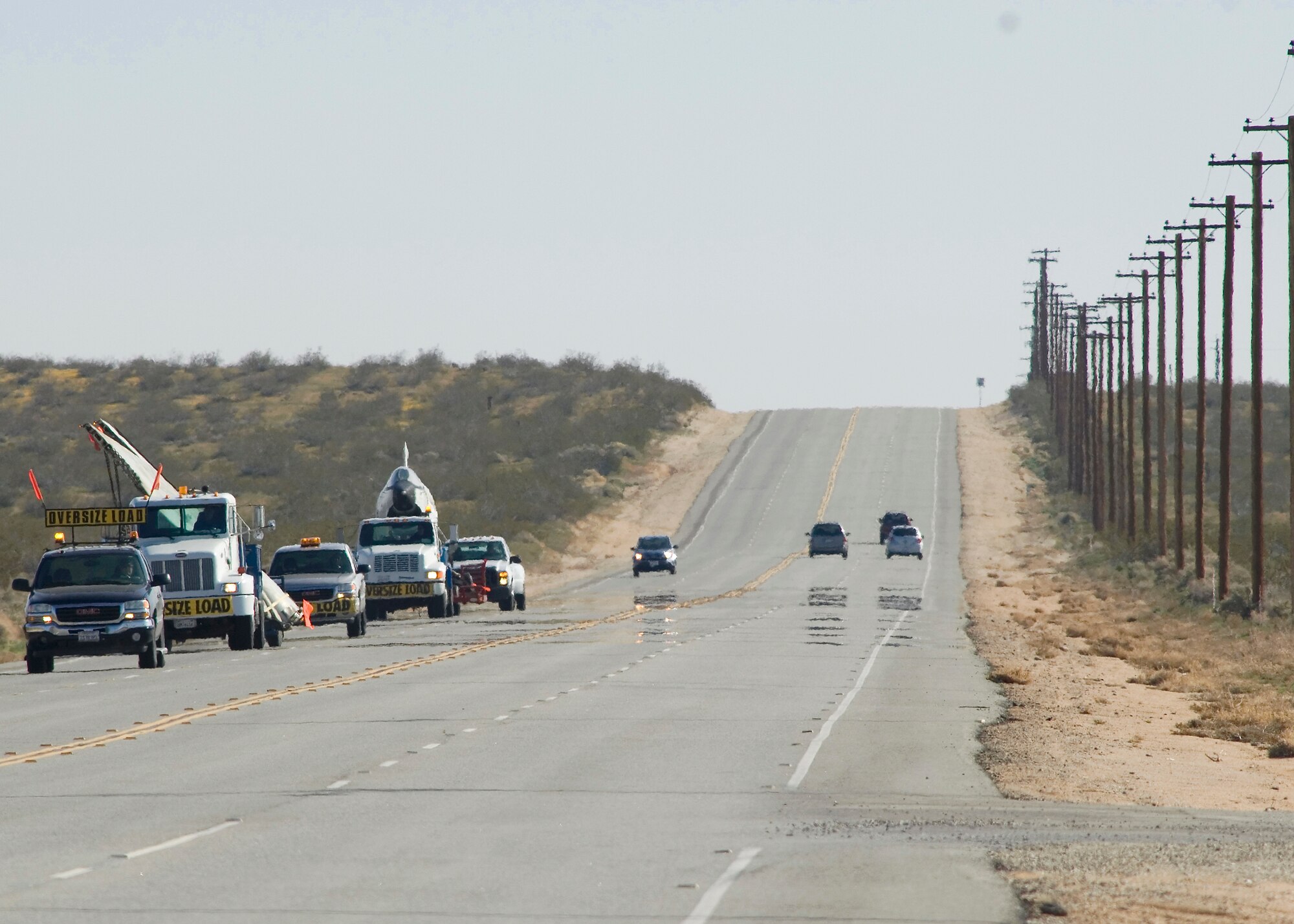 Contractors move an RF-8 to Castle Air Museum March 25. The 1950's era aircraft began its departure 9:30 a.m. from the Air Force Flight Test Center Museum. (Air Force photo by Mike Cassidy)