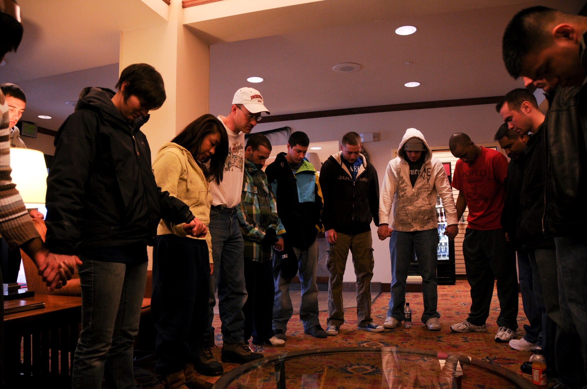 Chaplain (Capt.) Phillip Griffin leads everyone in prayer before the 382.15 mile journey from the hotel in Anchorage, Alaska to Eielson Air Force Base, Alaska, March 22, 2009. The ski trip was funded by the chapel to boost the morale of Airmen by socializing and also providing time to grow spiritually. (U.S. Air Force photo/Airman 1st Class Laura Max)
