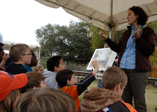 Julie Binz, an Earth Day volunteer, teaches Charleston area elementary school students about reptiles during the Charleston AFB Earth Day celebration. (U.S. Air Force photo/Senior Airman Katie Gieratz)