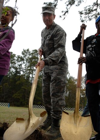 Col. Frank Jones and students from Westview Elementary School in Goose Creek plant a tree during the Earth Day celebration on Charleston AFB, March 25.  More than 600 students came to the base's 13th annual Earth Day celebration. Colonel Jones is the 437th Mission Support Group commander. (U.S. Air Force photo/Senior Airman Katie Gieratz) 