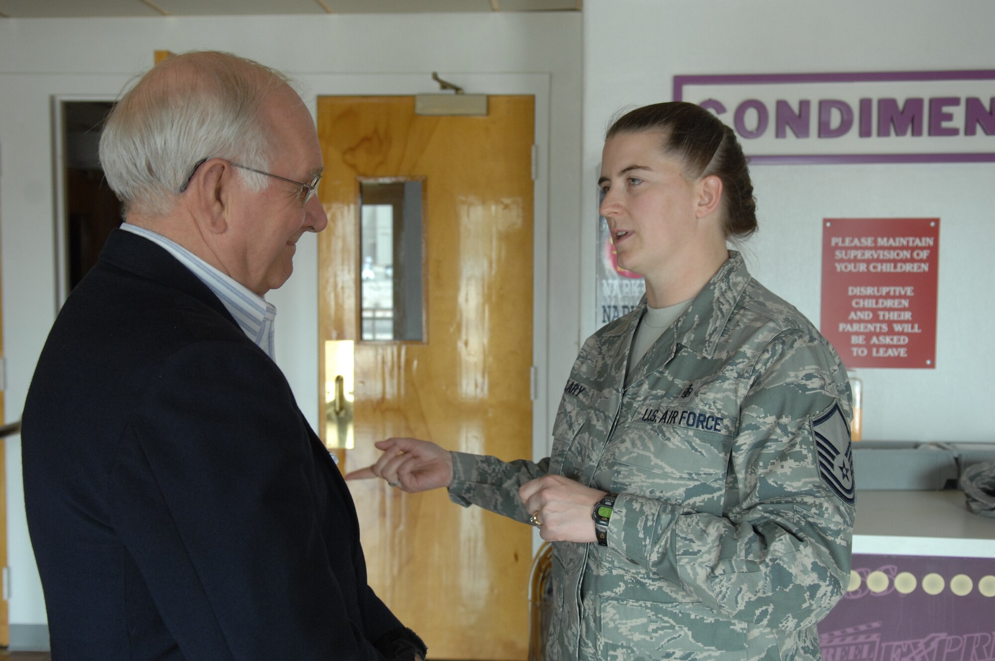 Master Sgt. Jodi Clary thanks Chief Master Sgt. Sam Parish (ret.) for his dedication and service to the Air Force and the nation. The 8th Chief Master Sgt. of the Air Force addressed Airmen and talked about the progress of the Air Force during his visit March 20. (U.S. Air Force photo/SSgt Anthony Nelson Jr)