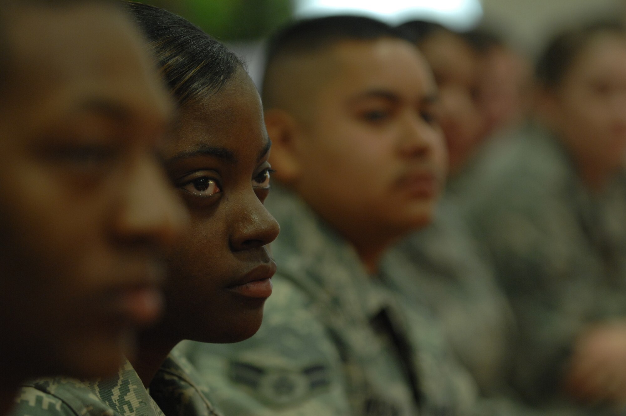 Airman 1st Class Jasmine Powell listens as the 8th Chief Master Sgt. of the Air Force, Chief Master Sgt. Sam Parish (ret.) talks to Airmen during breakfast at the Shifting Sands Dining Facility on Holloman Air Force Base, N.M., March 20. Airman Powell is a Contract Specialist assigned to the 49th Contracting Squadron.

 (U.S. Air Force photo/SSgt Anthony Nelson Jr)
