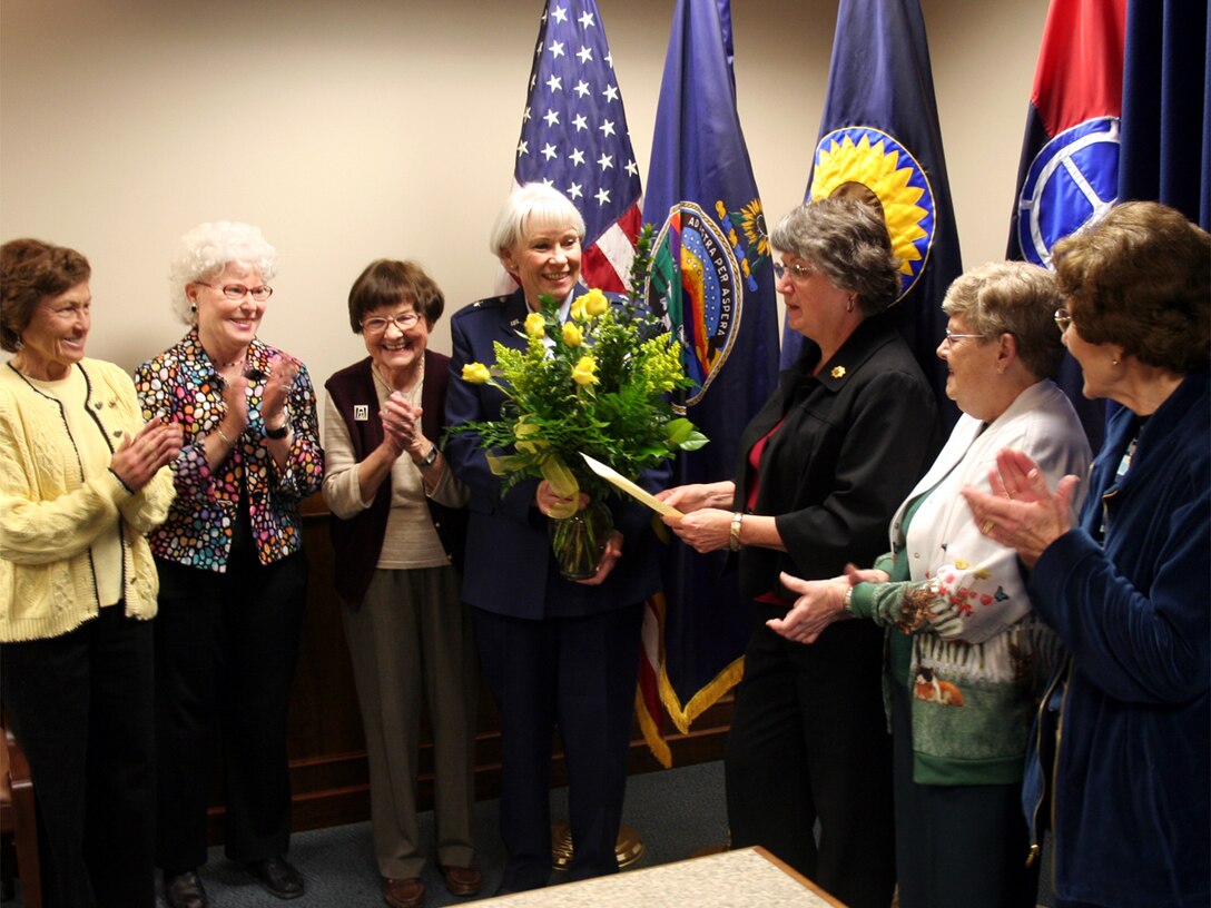 Brig. Gen. Deborah Rose is presented a bouquet of yellow roses from members of
the Zonta Club in recognition of her role in advancing the stature of women in the
military. (photo by Staff Sgt. Tim Traynor)