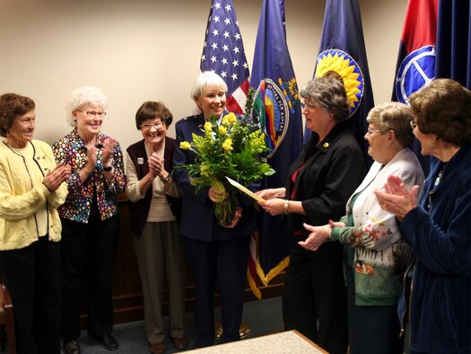 Brig. Gen. Deborah Rose is presented a bouquet of yellow roses from members of
the Zonta Club in recognition of her role in advancing the stature of women in the
military. (photo by Staff Sgt. Tim Traynor)