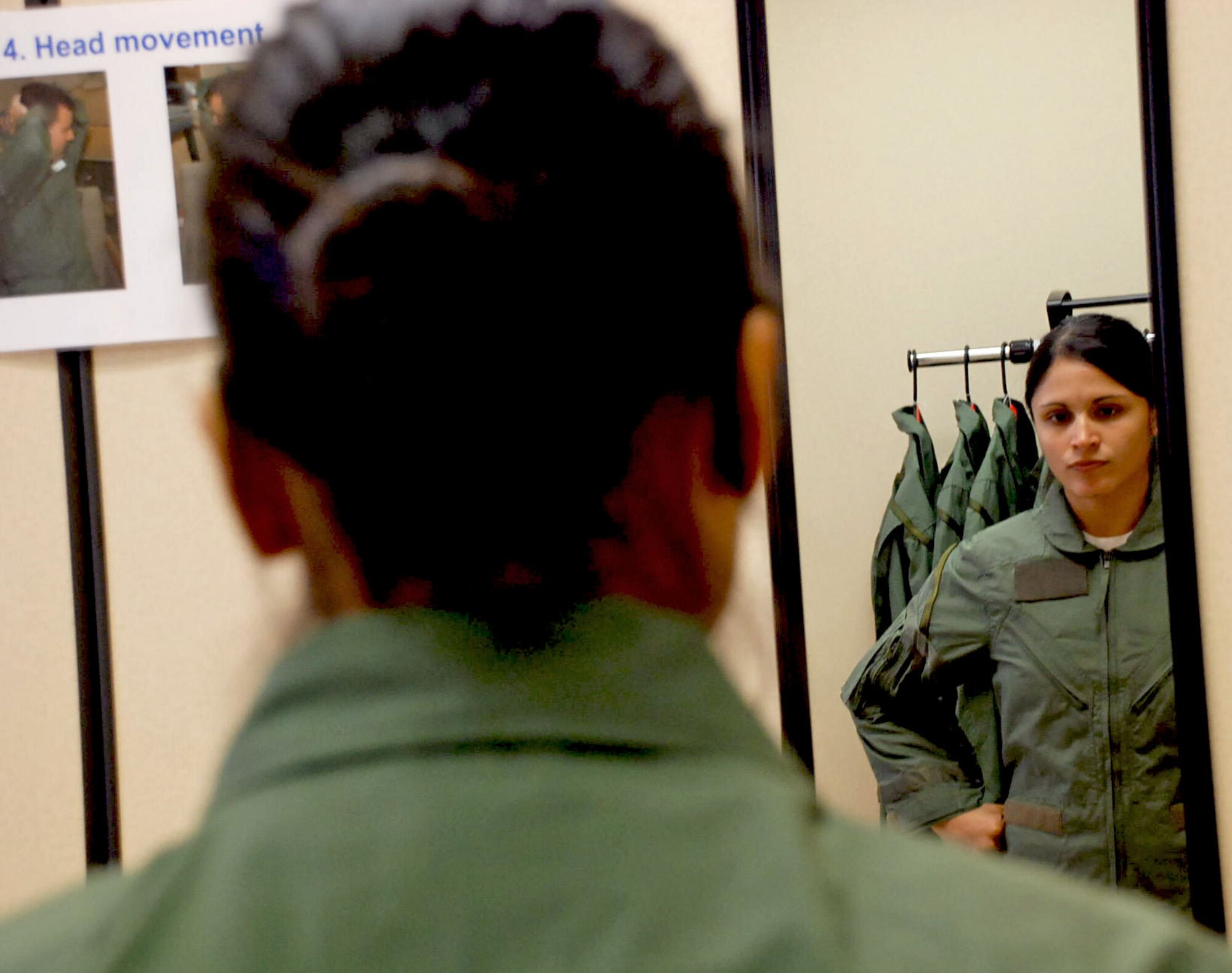 LAUGHLIN AIR FORCE BASE, Texas – Capt. Valerie Goldsworthy, a Reservist with the 68th Air Lift Squadron from Lackland AFB and a civilian with the 87th Flying training Squadron, tries on a model F-35 Lightning II flight suit to compare it to her customary flight suit during a research study for the F-35 flight suit here recently. (U.S. Air Force photo by Airman 1st Class Sara Csurilla)