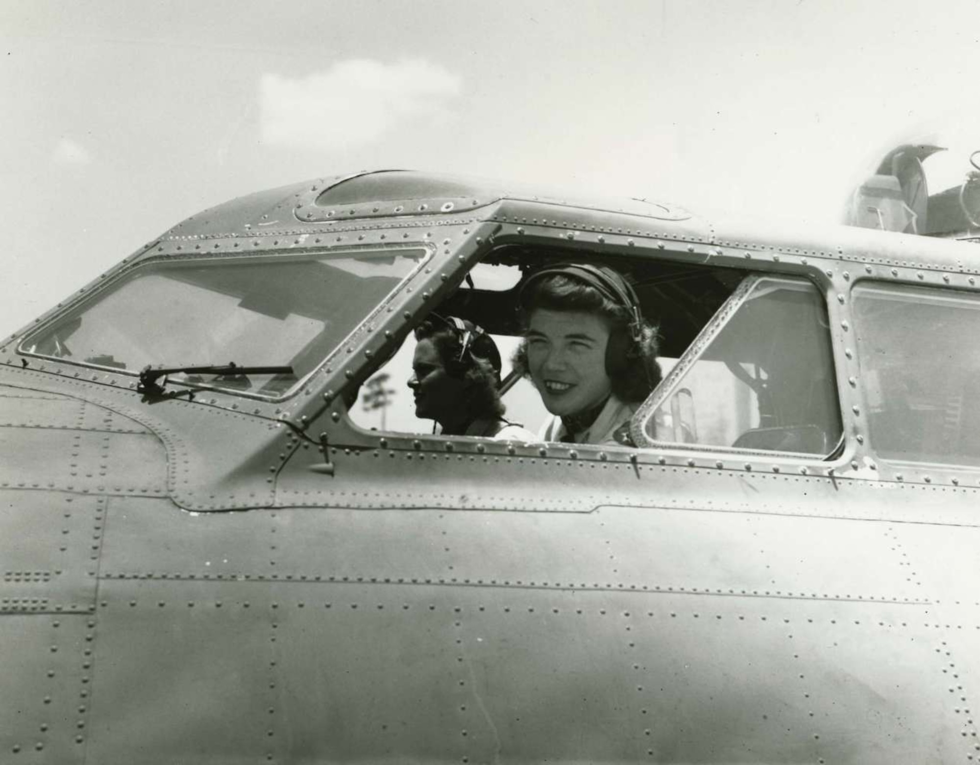 Dawn Seymour looks out the cockpit window of a B-17 Bomber during a World War II training mission. Mrs. Seymour was one of five 2009 inductees into the Women In Aviation History, Internationational Pioneer Hall of Fame. She was one of 13 women qualified to fly the giant bombers during the war. Two officers representing the 931st Air Refueling Group, Maj. Leah Schmidt and Capt. Gia Witmer, witnessed the hall of fame induction ceremony at a Women in Aviation Conference in Atlanta, Ga. (Courtesy photo)