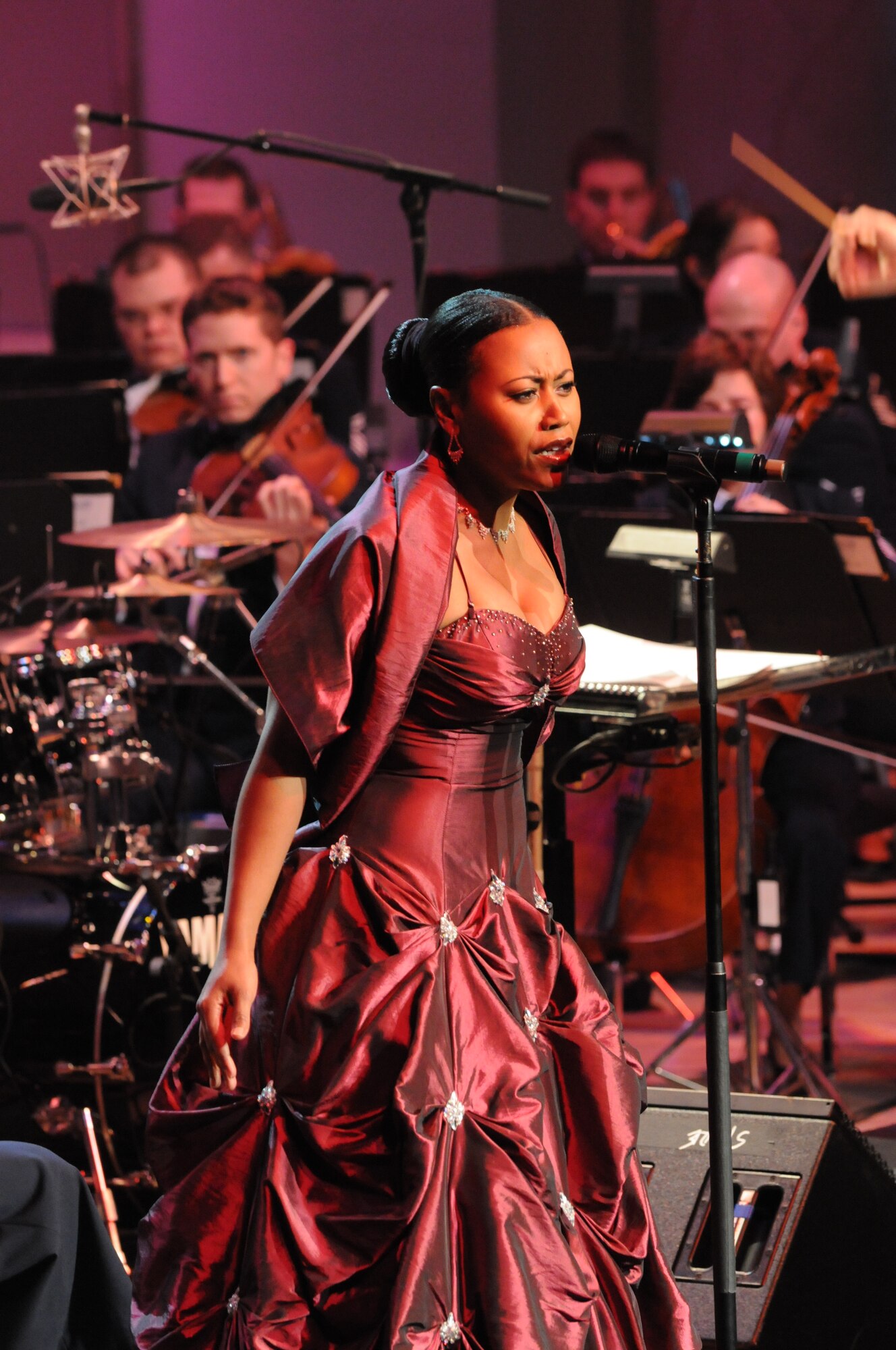 Master Sgt. Regina Coonrod, member of the U.S. Air Force Band rock band Max Impact, performs at the Guest Artist Series concert at the Daughters of the American Revolution Constitution Hall in Washington March 21.The concert featured contemporary jazz pianist Keiko Matsui. The Band's Guest Artist Series is free of charge and open to the public. For more information, visit the U.S. Air Force Band’s website at www.usafband.af.mil. (U.S. Air Force photo by Senior Airman Sean Adams)