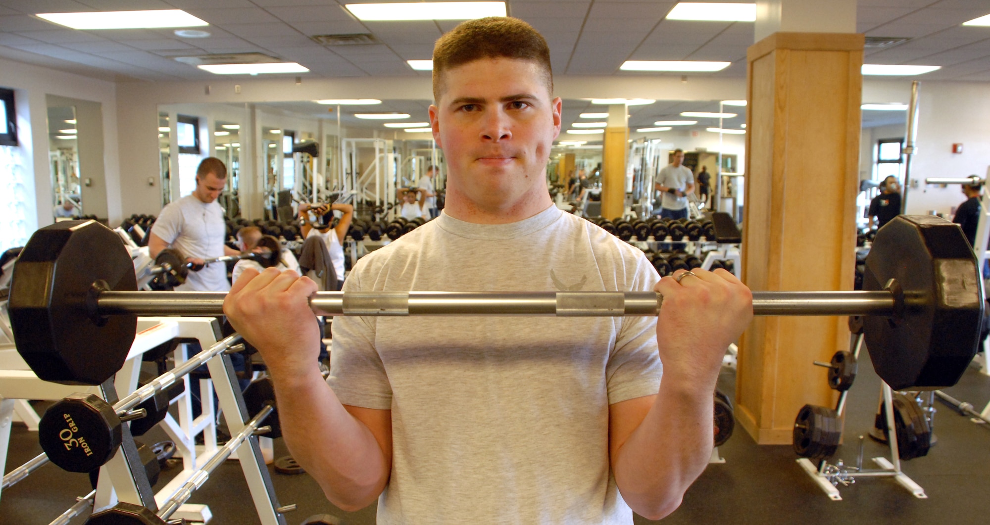 Staff Sgt. Michael Gump, 436th Force Support Squadron, does arm curls at the Fitness Center. Sergeant Gump was on the team that took first place in the Biggest Winner Competition by losing 126.6 pounds. (U.S. Air Force photo/ Airman 1st Class Shen-Chia Chu)