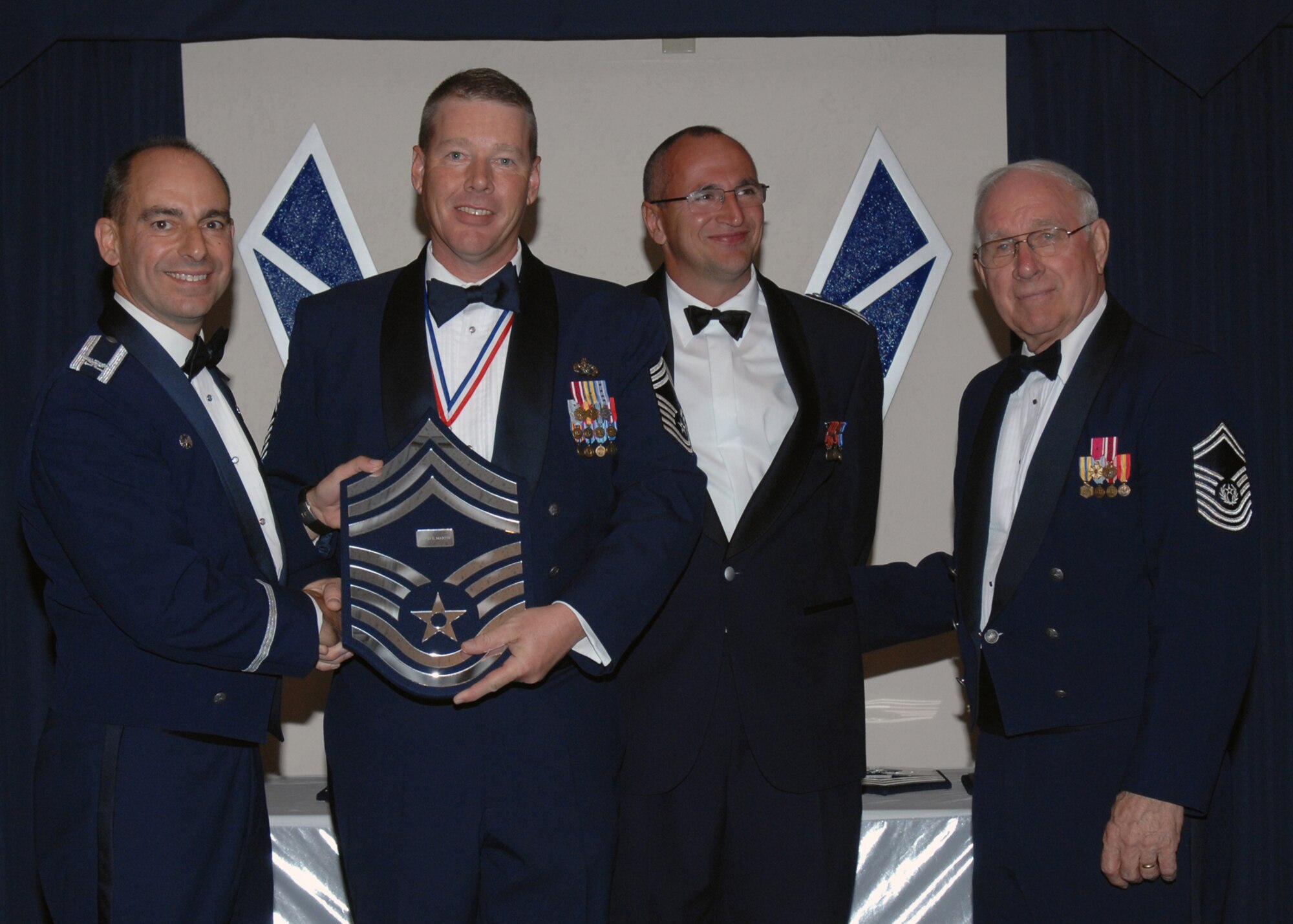 49th Fighter Wing Commander Col. Jeff Harrigian and German Flying Training Center Vice Commander Col. Hans Jocahim Weber along with the 8th Chief Master Sgt. of the Air Force, Chief Master Sgt. Sam Parish (ret.) recognizes Chief Master Sgt. David Martin as one of the Air Force's newest Chief Master Sergeants during the Chief Recognition Ceremony  March 21 at Holloman Air Force Base, N.M.
 (U.S. Air Force photo/SSgt Anthony Nelson Jr)