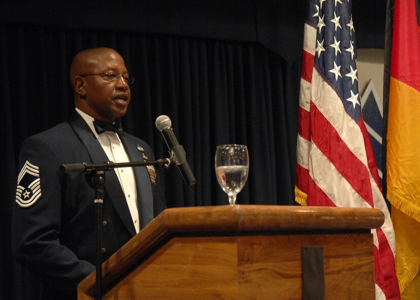 Chief Master Sgt. Jerome N. Baker, 49th Mission Support Group, Chief Enlisted Manager, sings the U.S. and German National Anthem during the Chief Recongition Ceremony March 21 at Holloman Air Force Base, N.M. (U.S. Air Force photo/SSgt Anthony Nelson Jr)