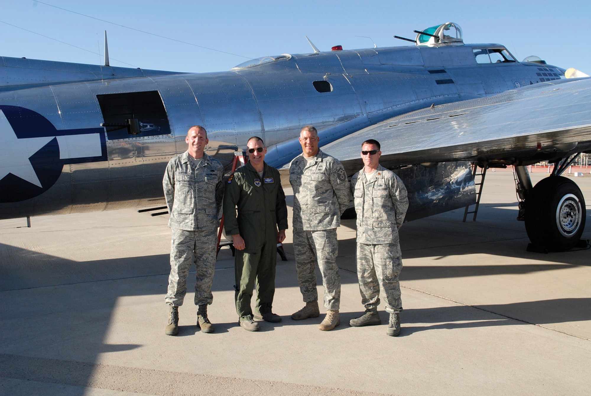 Brig. Gen. Kurt Neubauer, 56th Fighter Wing commander, stands in front of the Sentimental Journey, a B-17 bomber, with Annual Award winners 1st Lt. Robert Slaydon, 62nd  Aircraft Maintenance Unit;  Master Sgt. Scott Harris, 56th Security Forces Squadron and Maj. Brian Shawaryn, 756th AMU, after an incentive flight Sunday. (U.S. Air Force photo/Staff Sgt. Ian Dean)