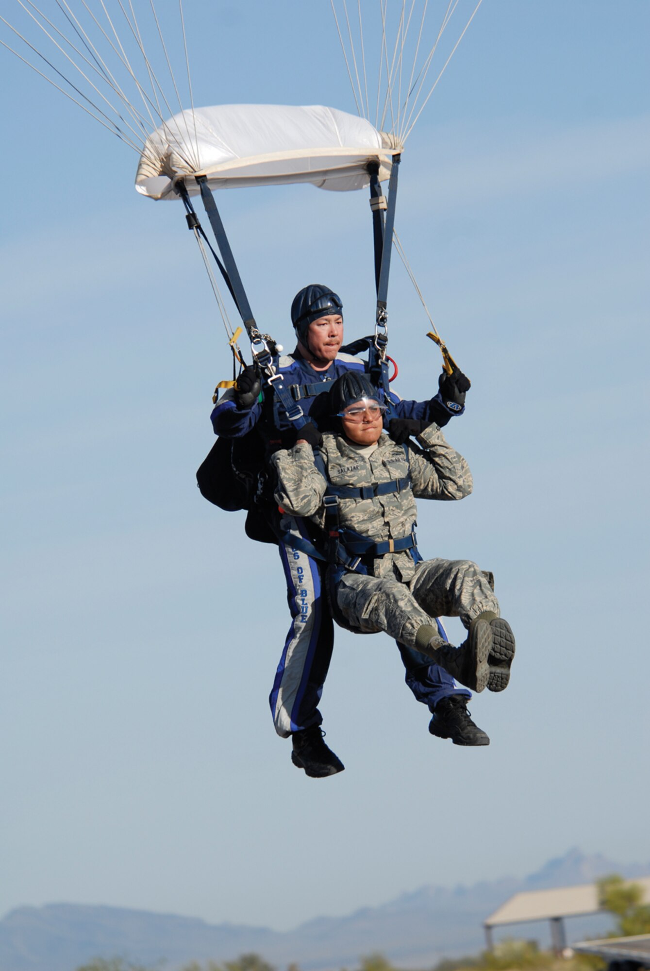 Staff Sgt. Joseph Salazar, 56th Equipment Maintenance Squadron crew chief, jumps with Master Sgt. Richard McClure, 98th Training Squadron. (photo/Deborah Silliman Wolfe)