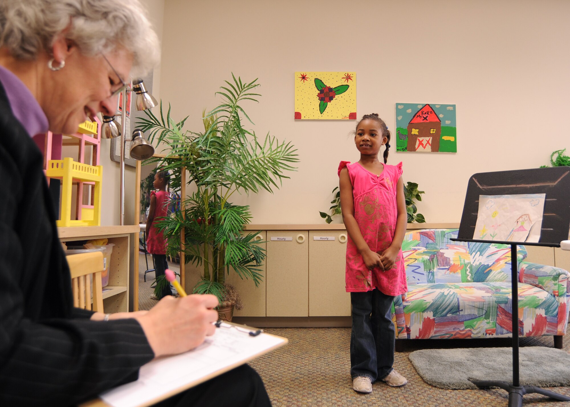 MCCONNELL AIR FORCE BASE, Kan. -- Monaye Sanders, daughter of Master Sgt. Diedra Sanders, 22nd Comptroller Squadron, and Tech. Sgt. King Sanders, 22nd Aircraft Maintenance Squadron, gives her jumping rope presentation to Beth Drescher, county extension agent, during a 4-H day at the School Age Program, March 20. The children of the program were given pointers on public speaking, presentation material, pronunciation and language to improve communication skills. (Photo by Airman 1st Class Maria Ruiz)