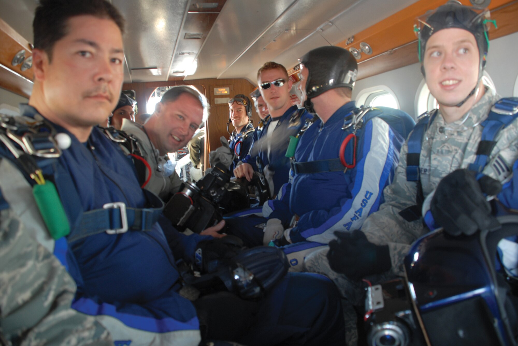 Luke Airmen await their chance to participate in a tandem jump with members from the 98th Flying Training Squadron jump team staff from the U.S. Air Force Academy in Colorado March 19. The jump staff consists of military personnel with years of military and/or civilian jumping experience that enables them to teach the next generation of jumpers at the Academy. (U.S. Air Force photo/ Airman 1st Class Tracie Forte)